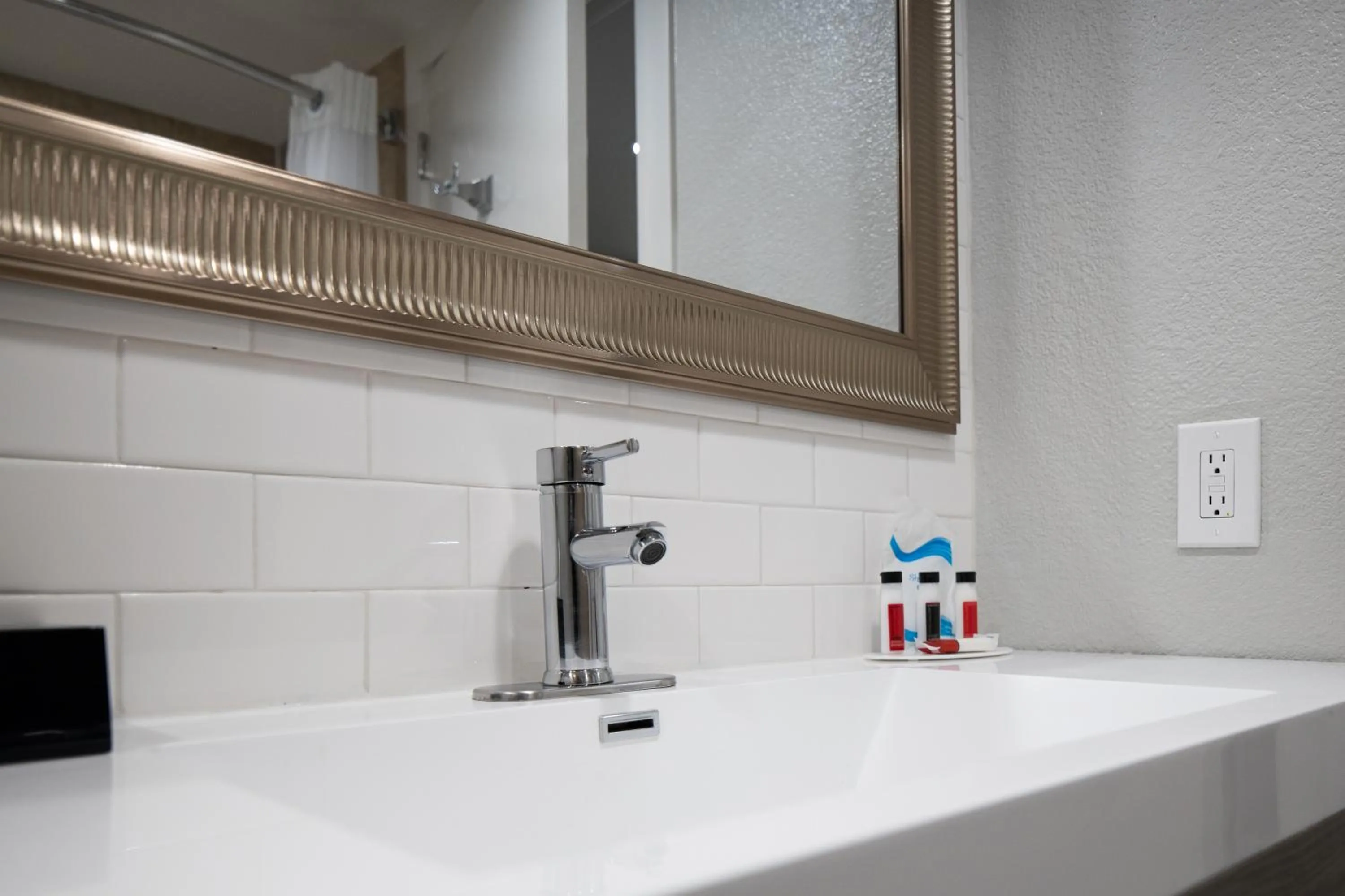 Bathroom in Prodigy Hotel, a Days Inn by Wyndham
