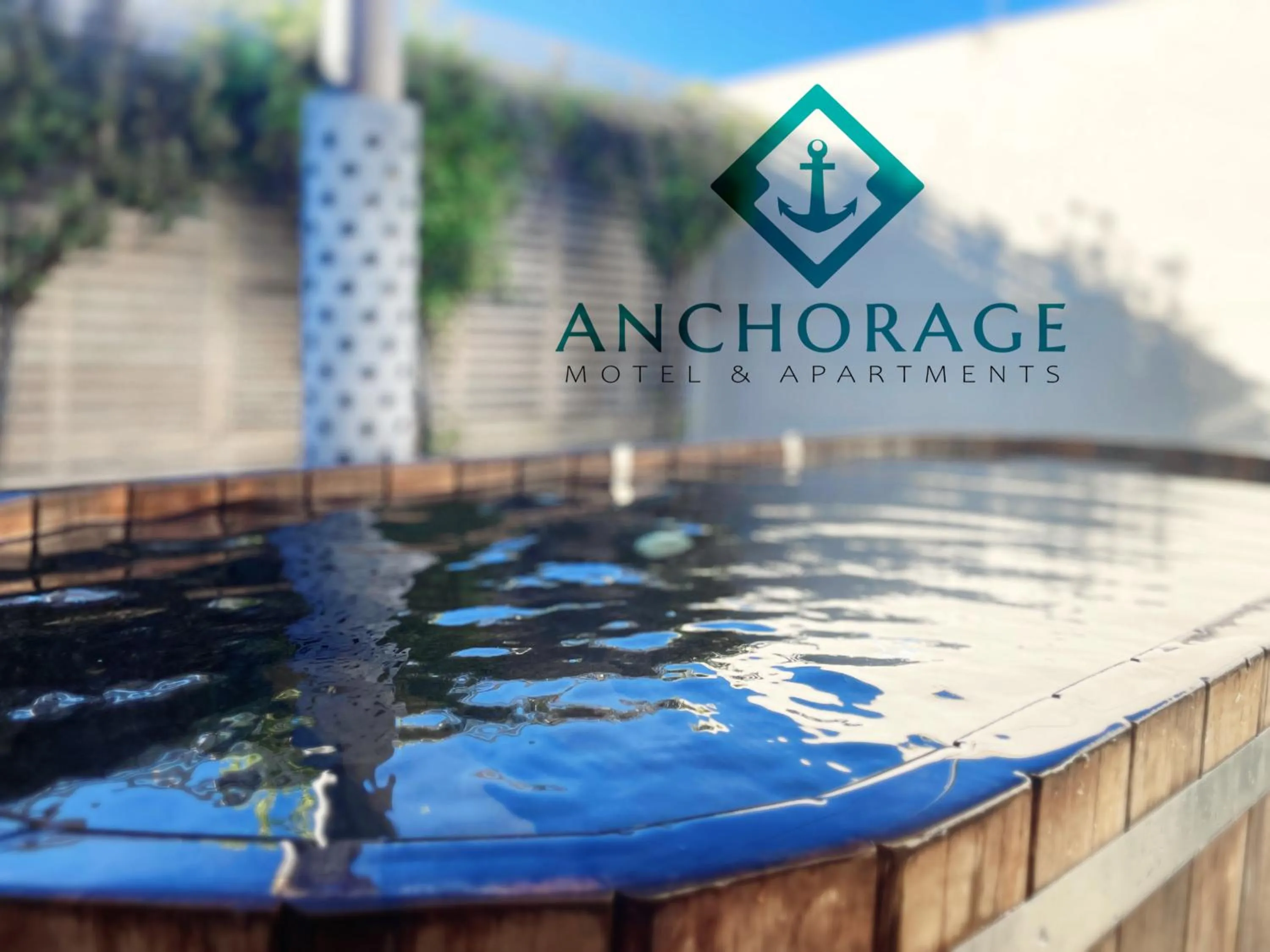 Property logo or sign in Anchorage Motel Apartments