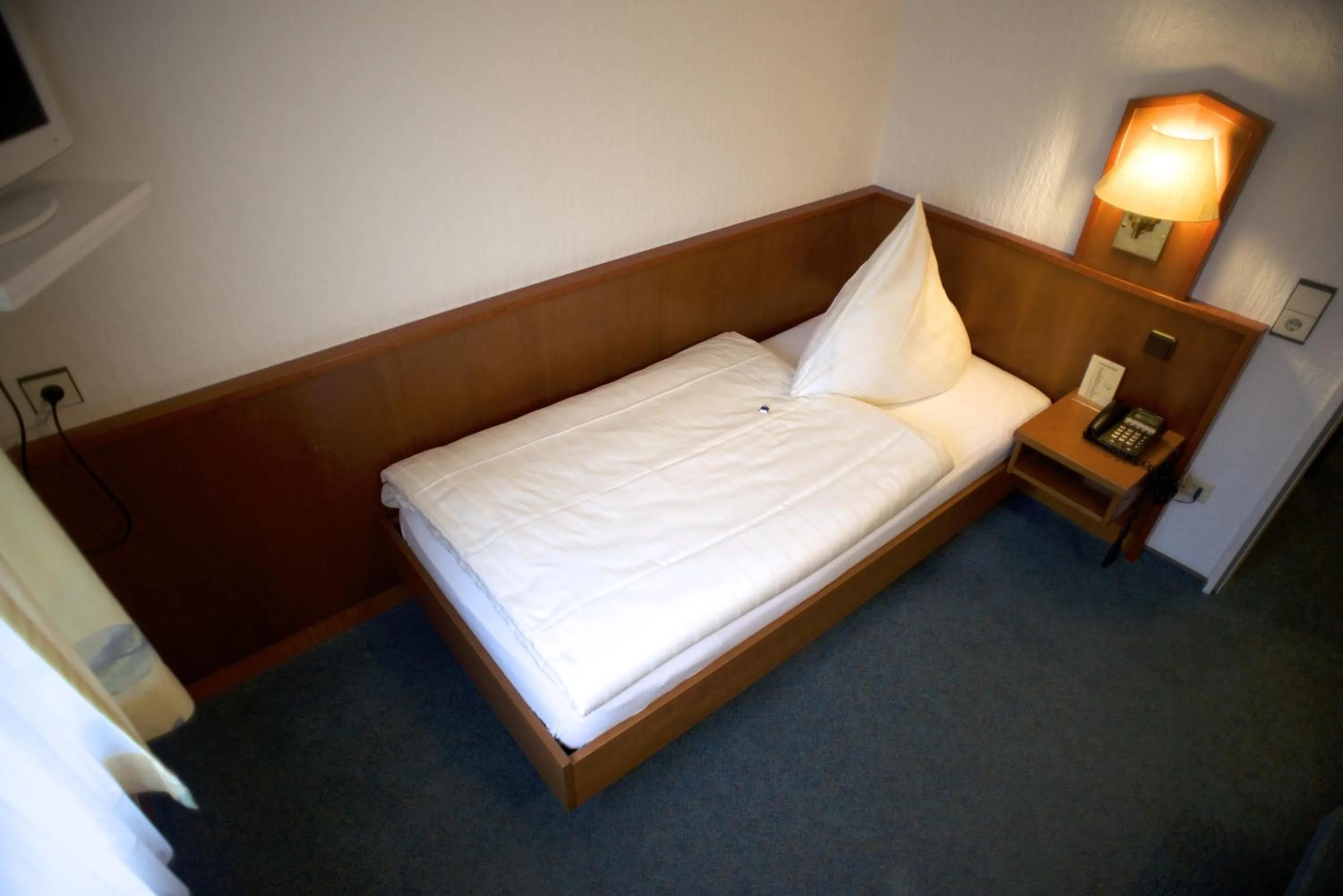 Bed in Hotel Marienhof Düsseldorf Neuss