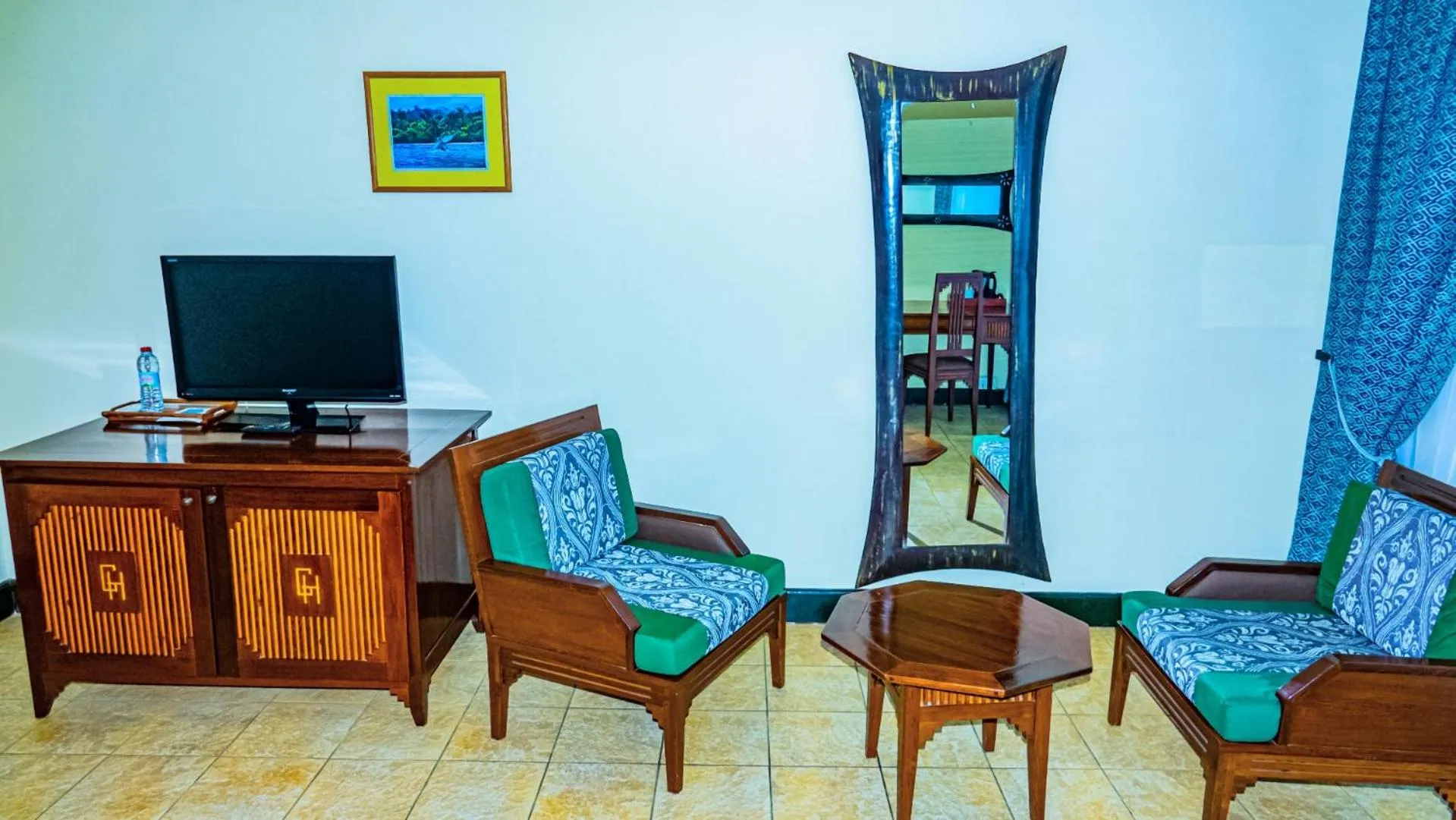 Communal lounge/ TV room in Le Grand Hôtel Diego