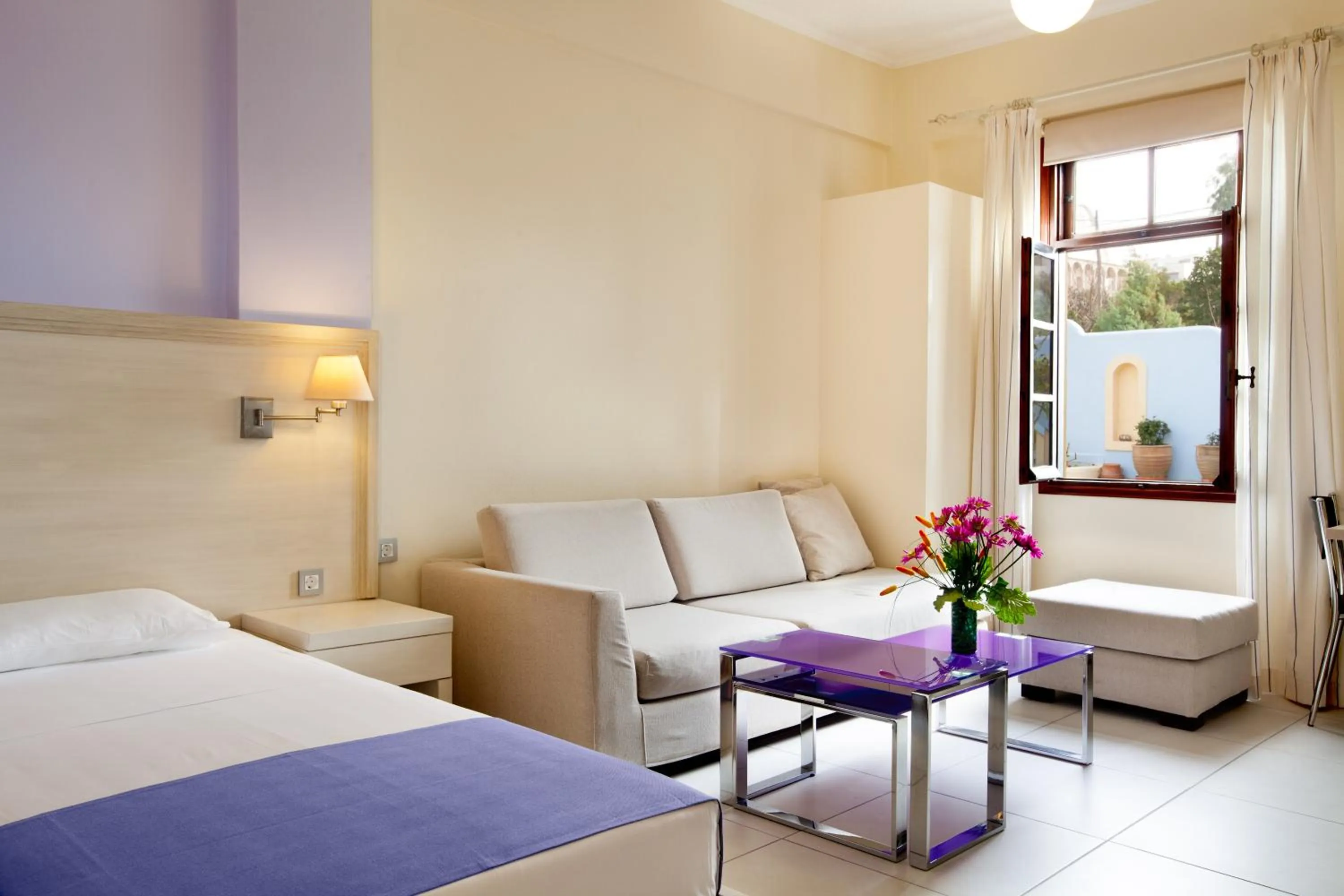 Seating area, Bed in Giorgi's Blue Apartments