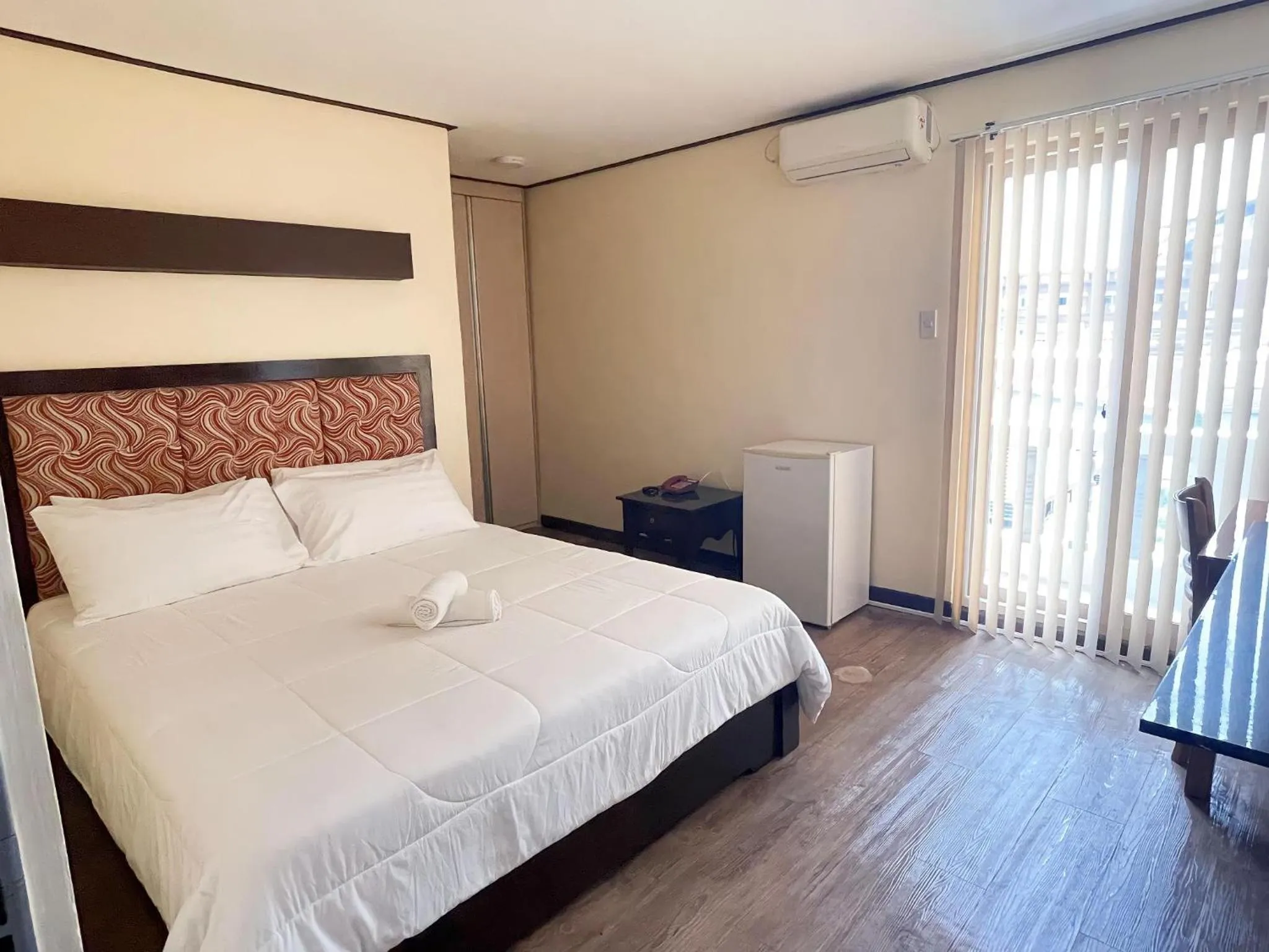 Bed in Jun and Helen Hotel and Restaurant