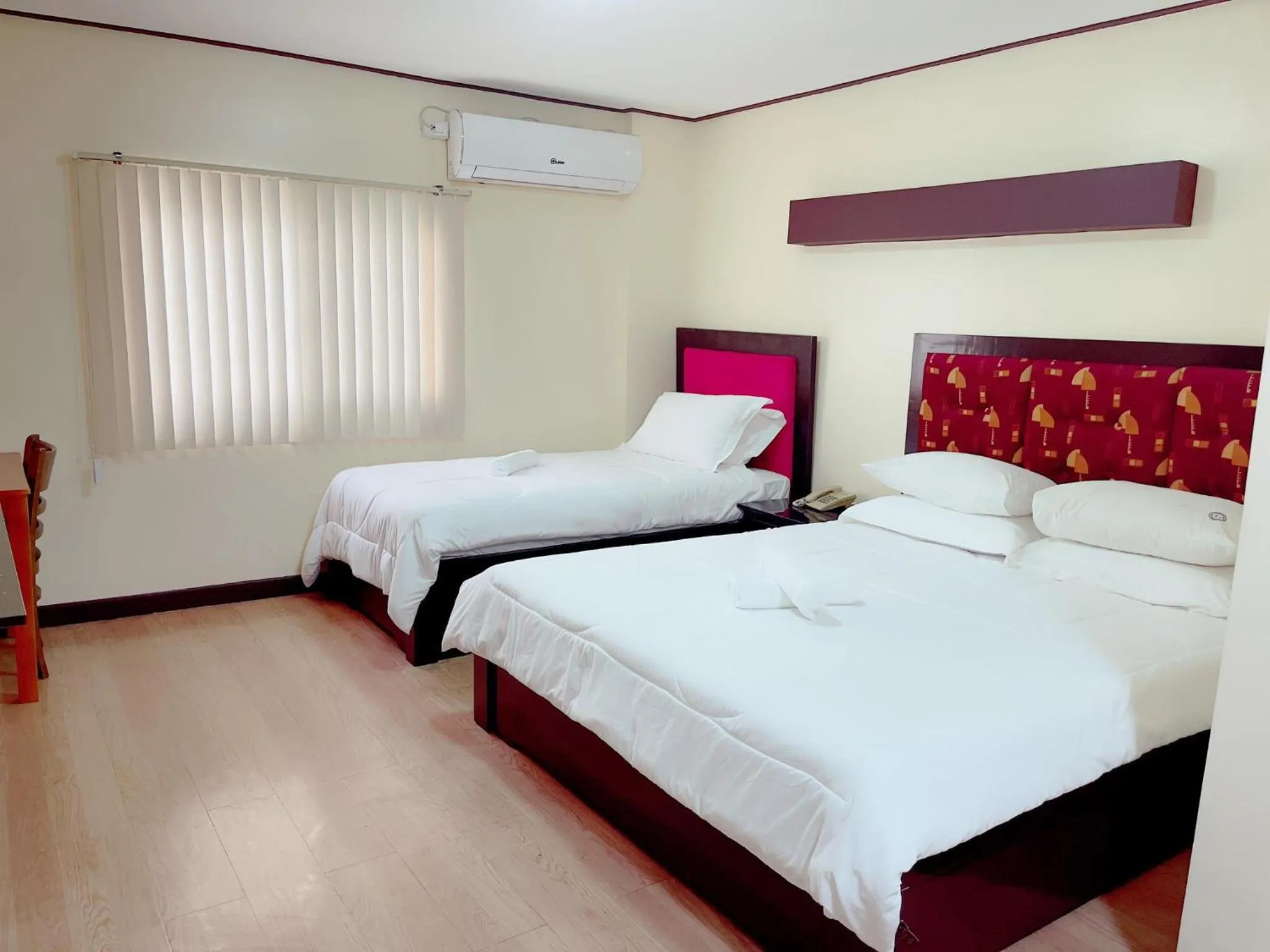 Bed in Jun and Helen Hotel and Restaurant