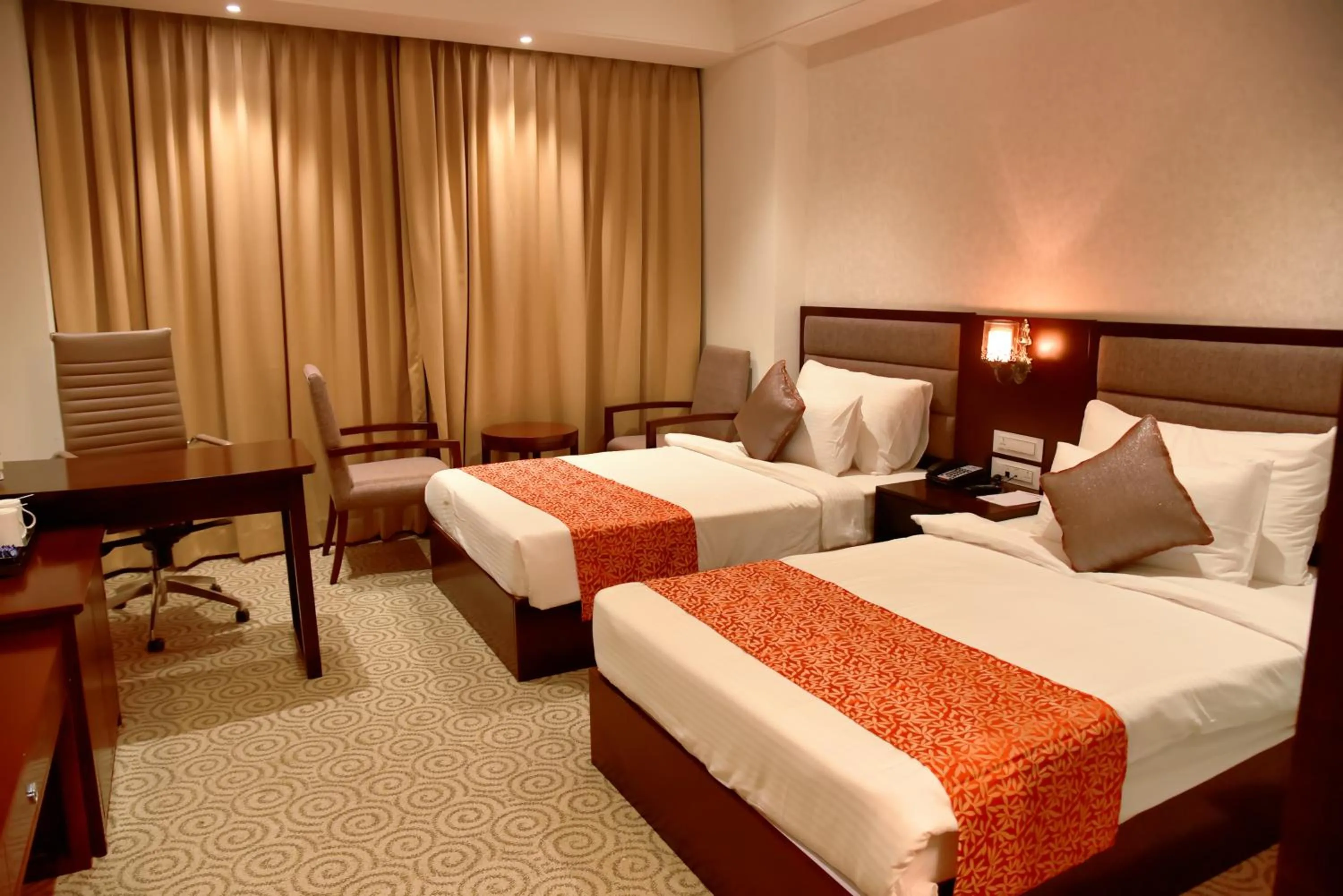 Staff, Bed in Pride Hotel & Convention Centre Indore