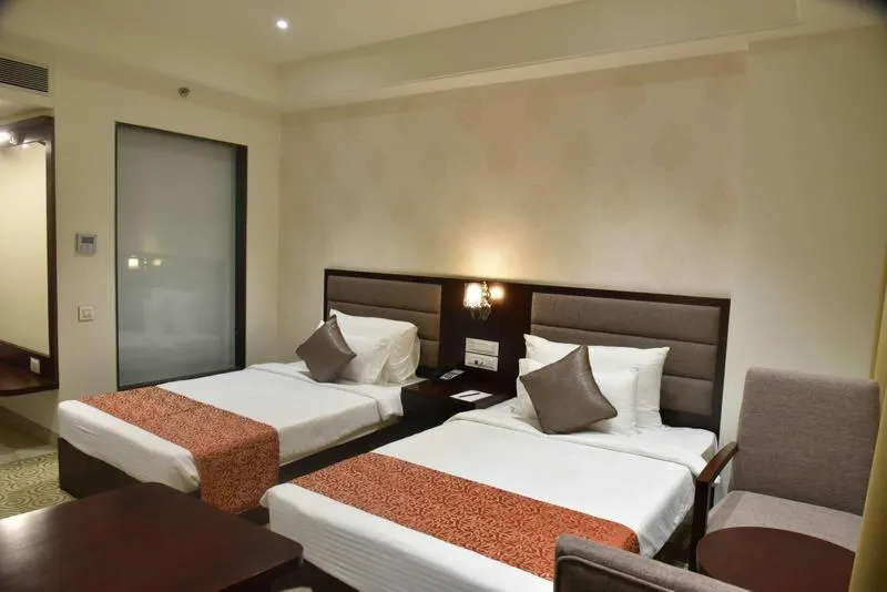 Bed in Pride Hotel & Convention Centre Indore