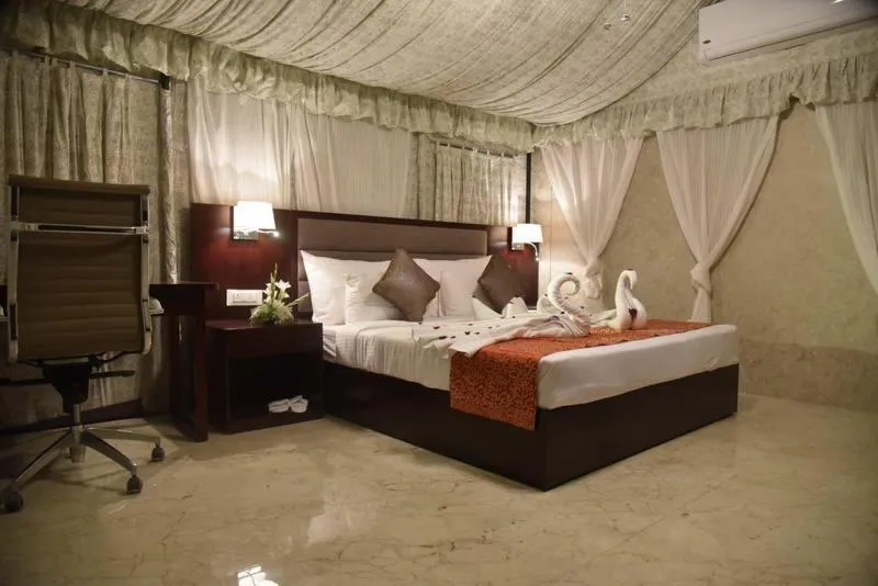 Bed in Pride Hotel & Convention Centre Indore