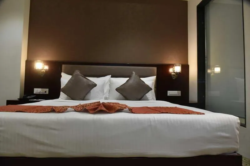 Bed in Pride Hotel & Convention Centre Indore
