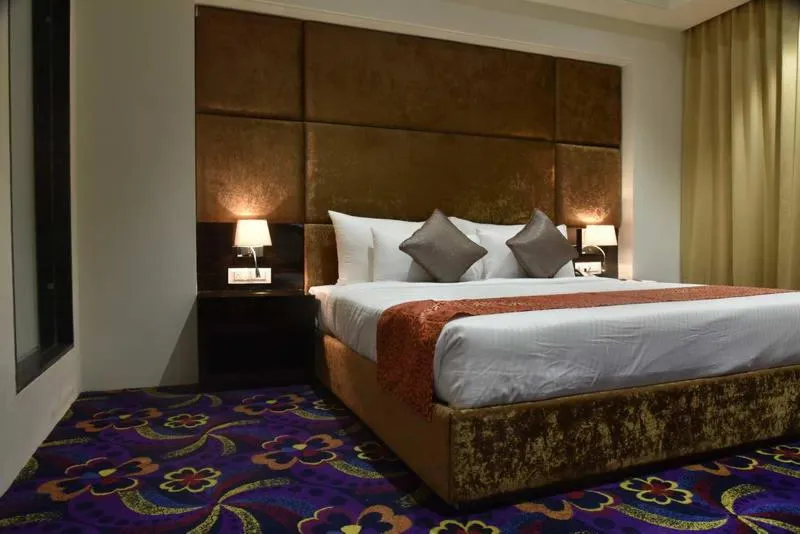 Staff, Bed in Pride Hotel & Convention Centre Indore