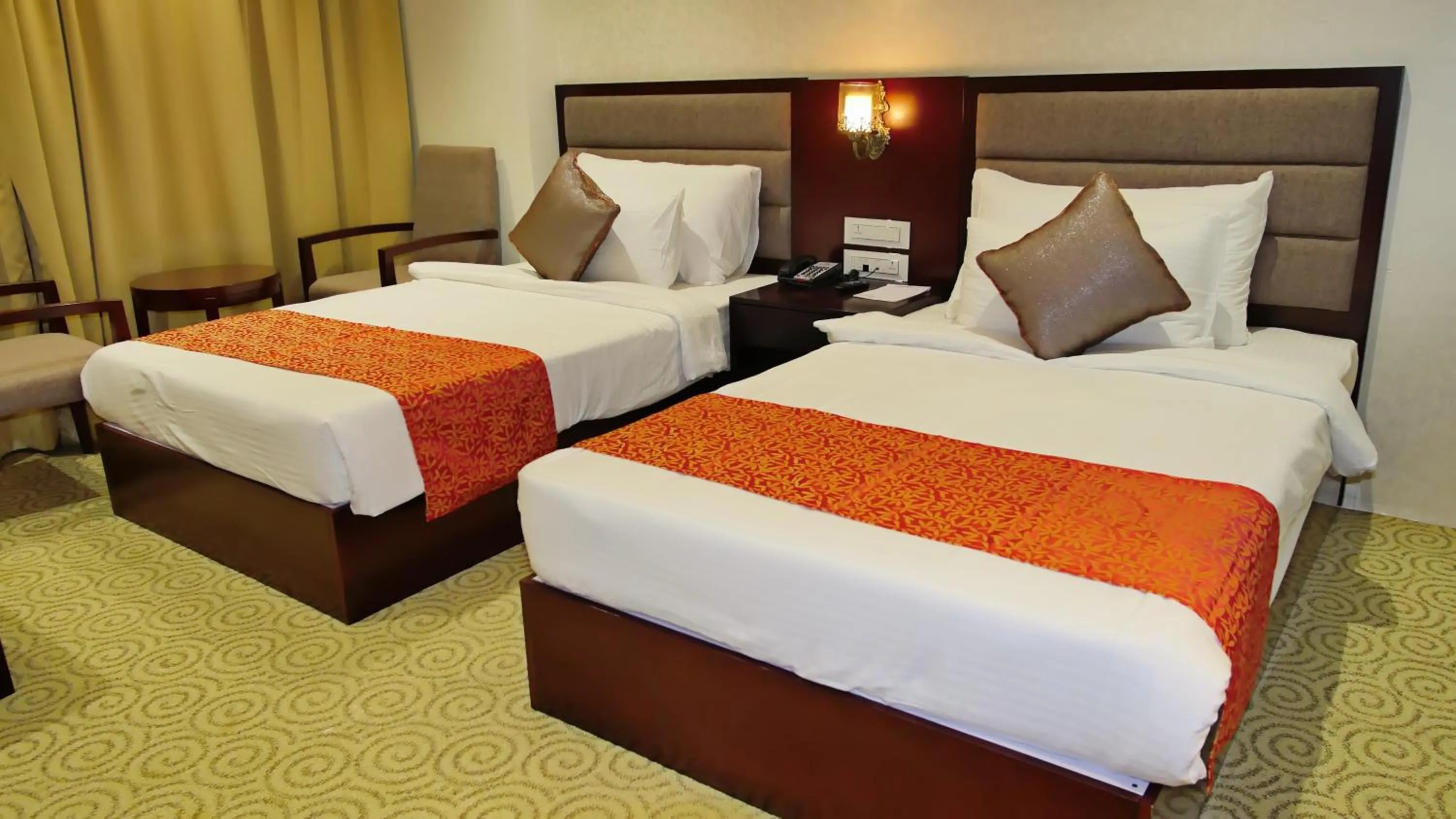 Staff, Bed in Pride Hotel & Convention Centre Indore