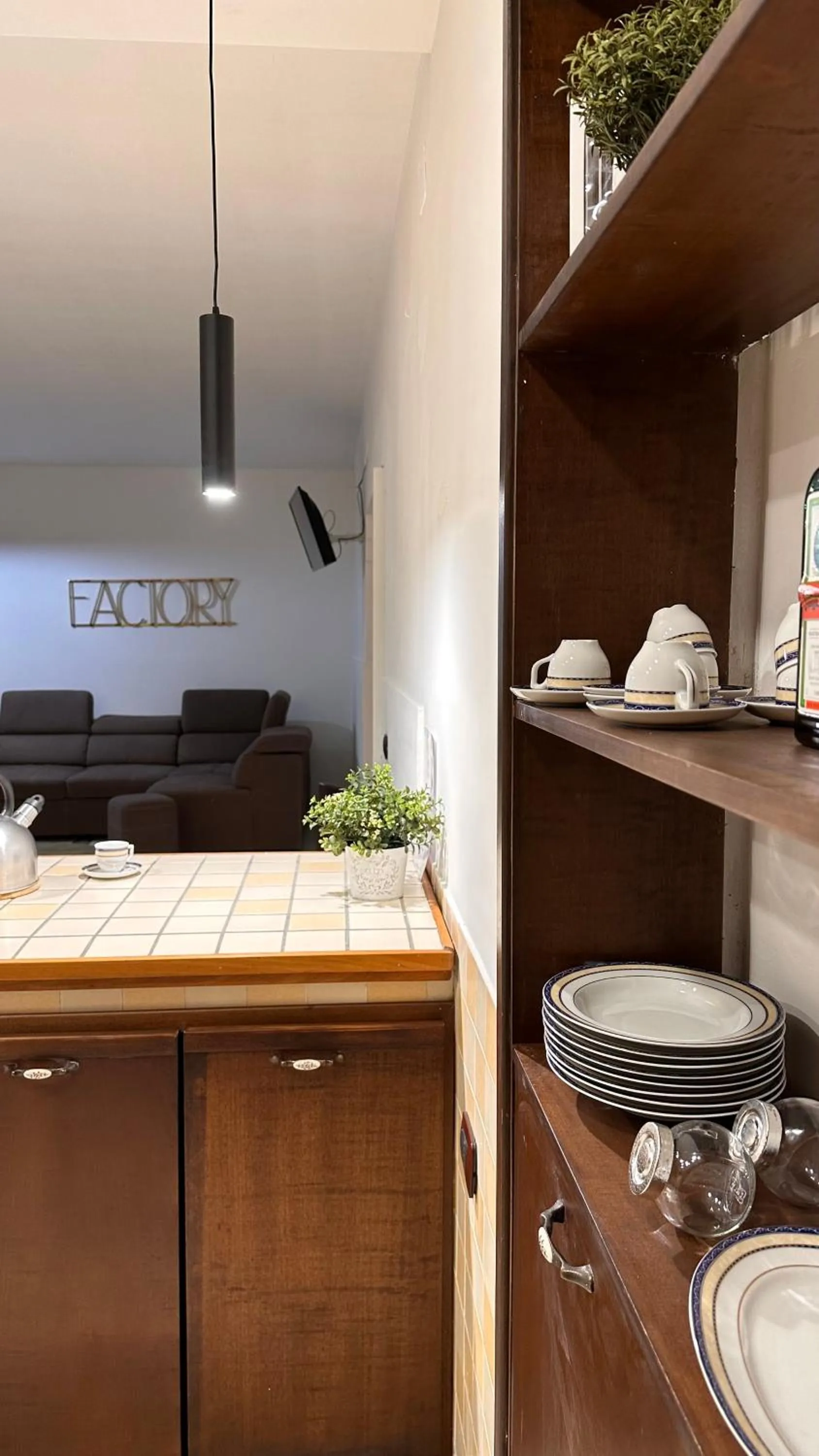 Kitchen or kitchenette in loft style taverna con sala giochi