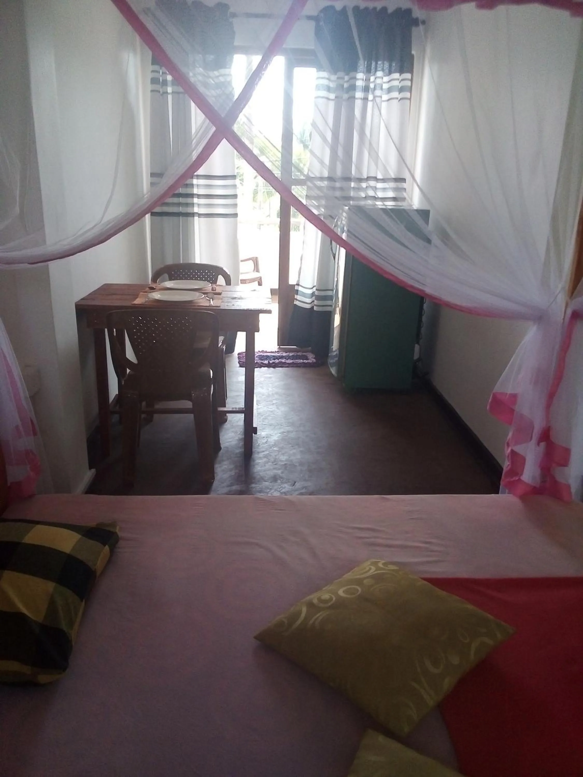 Dining area, Bed in Villa Maleena