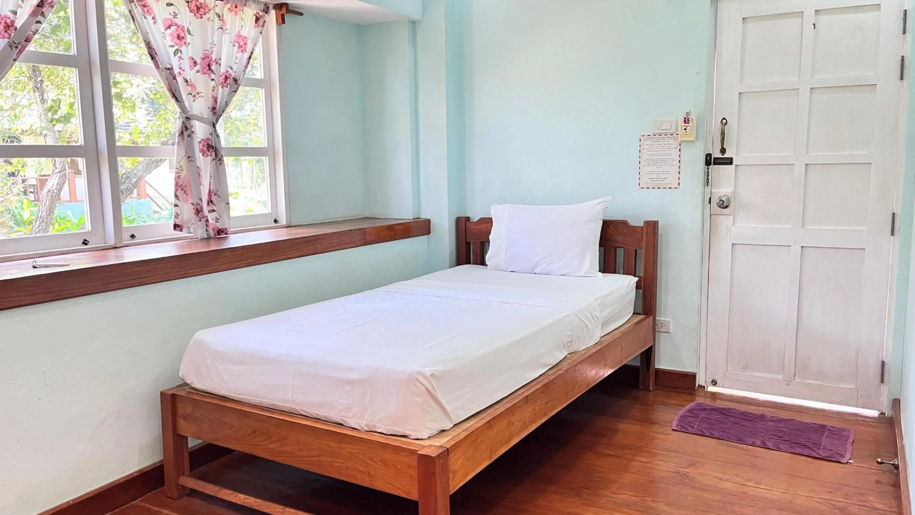 Bed in Pai Flora Resort