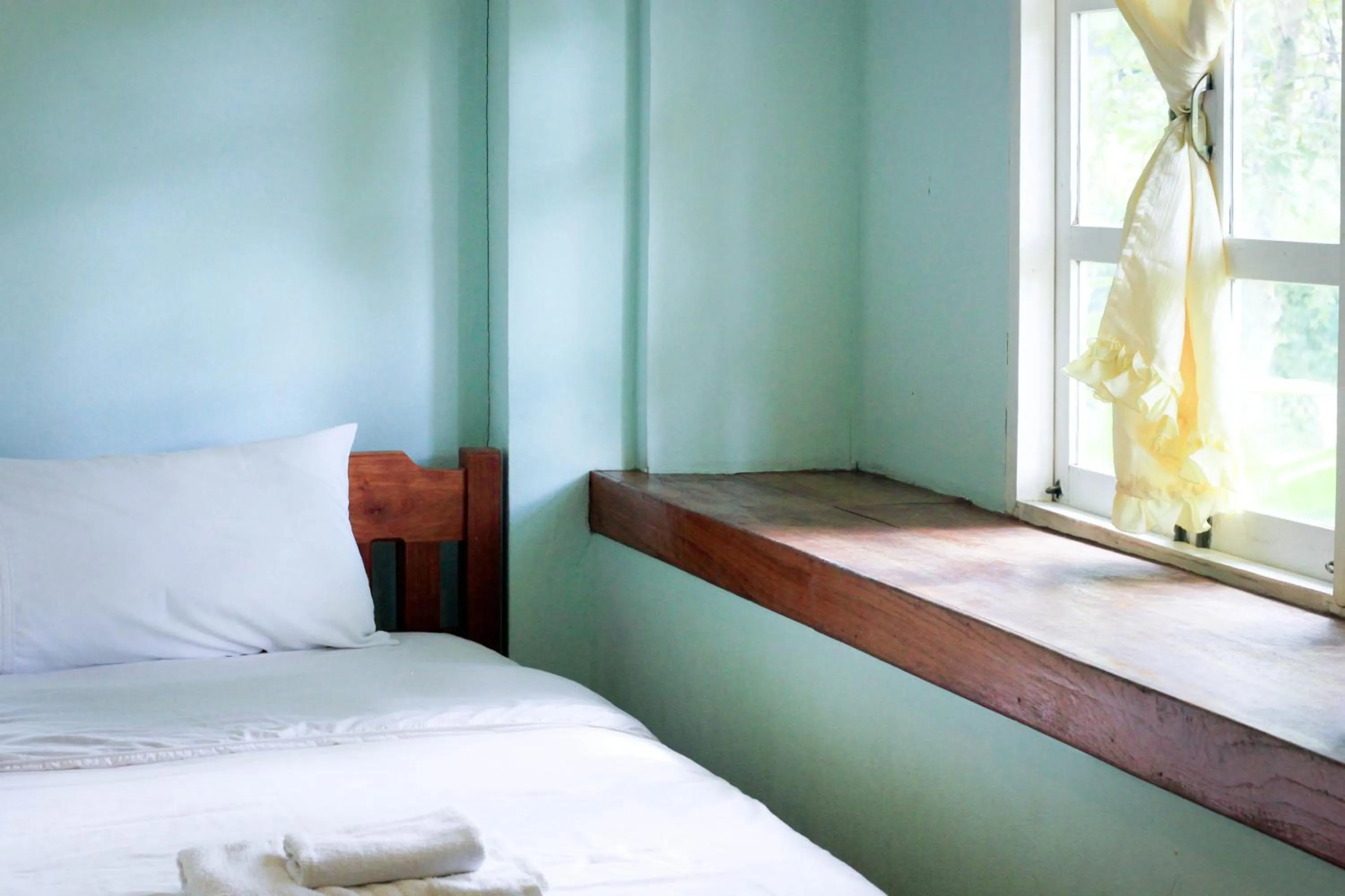 Bed in Pai Flora Resort