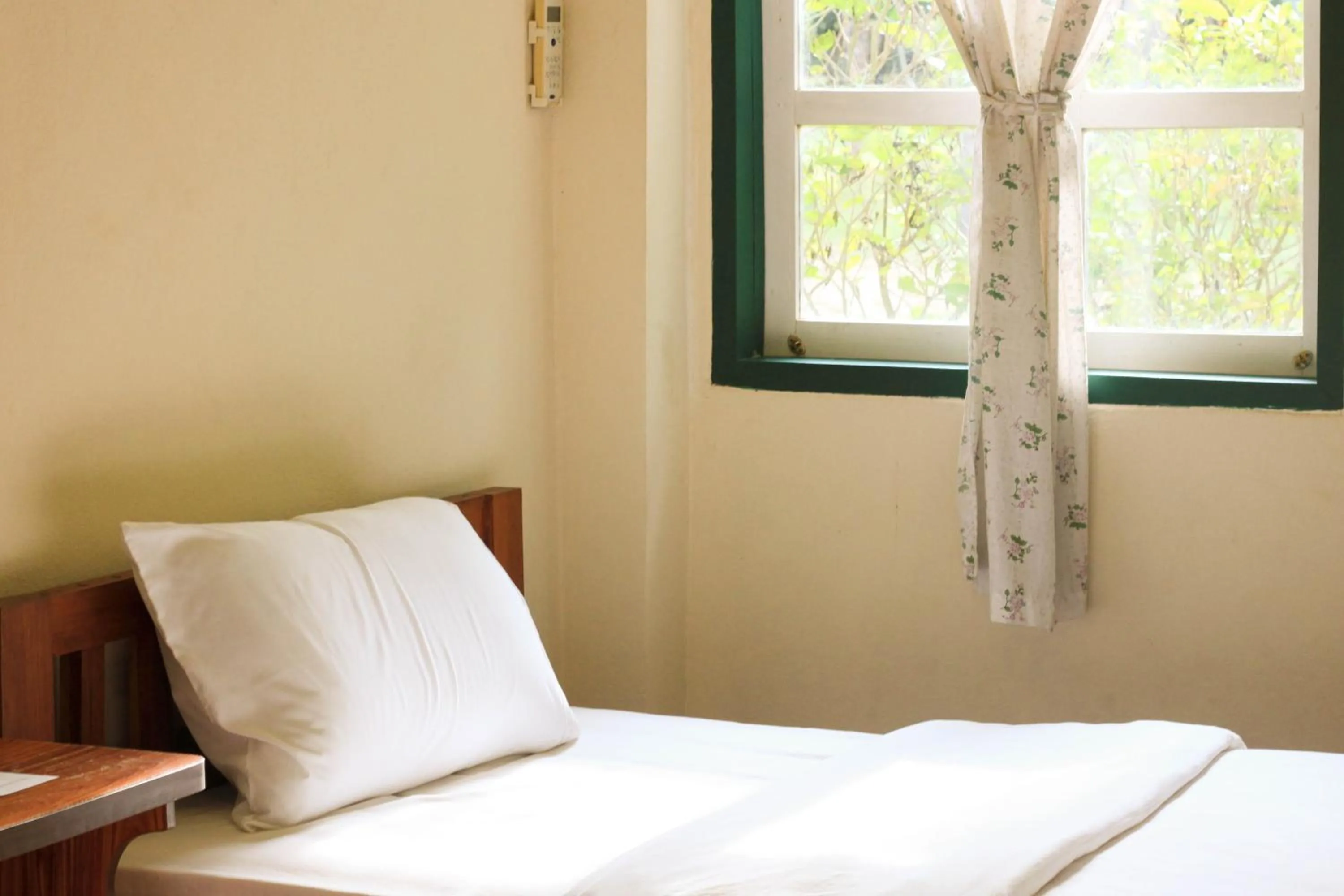 Bed in Pai Flora Resort