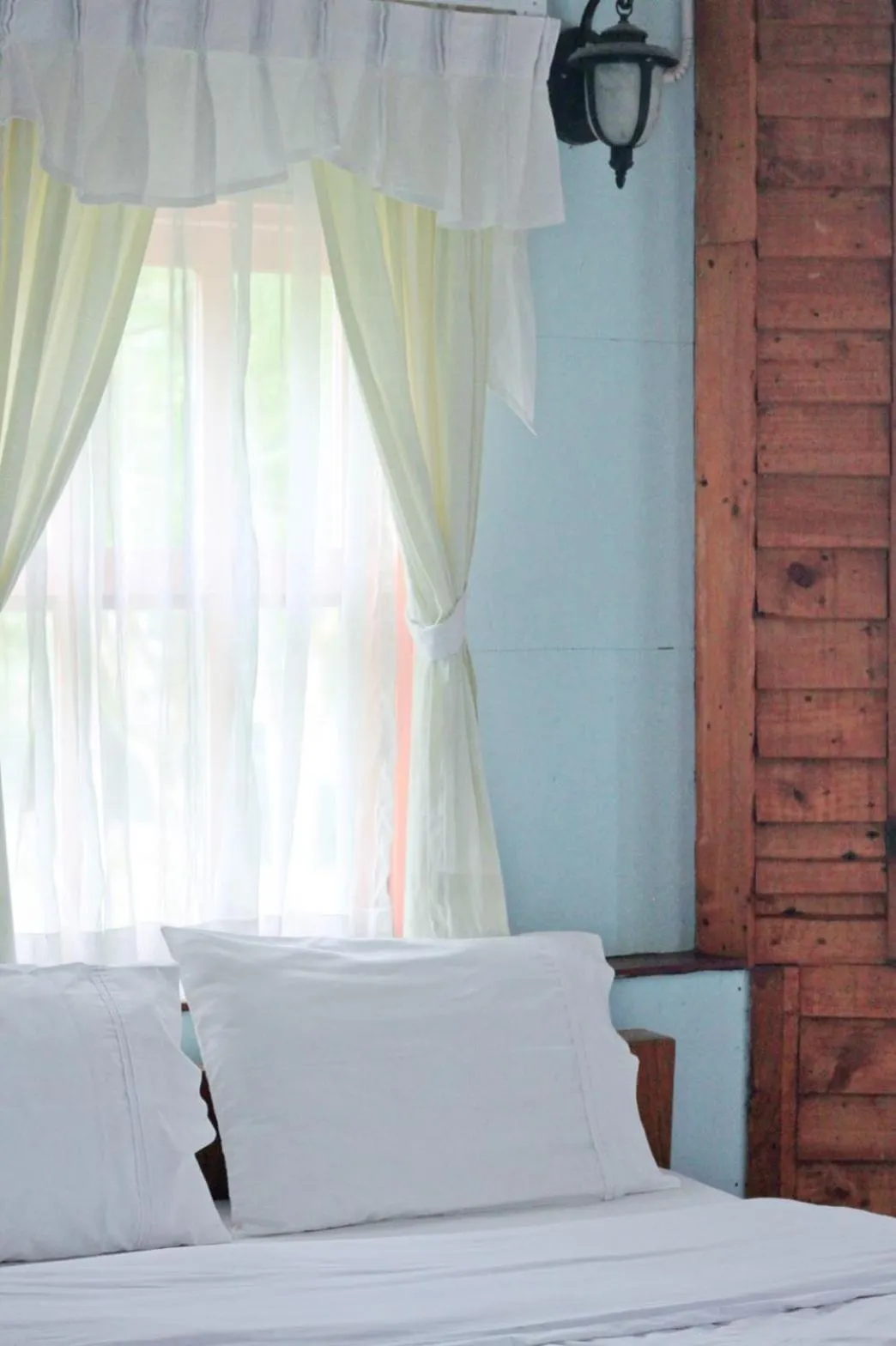 Bed in Pai Flora Resort