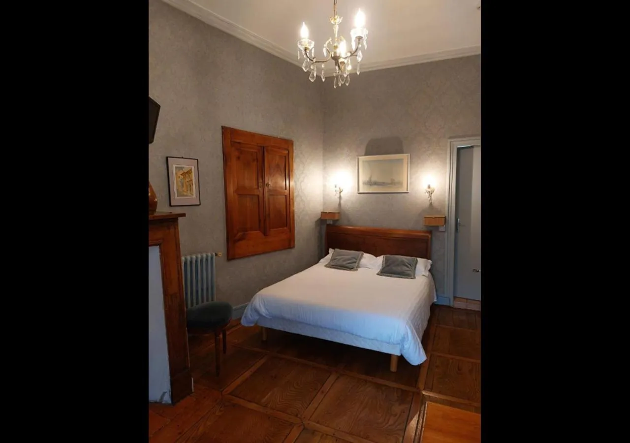 Bed in Logis Hôtel Beau Site