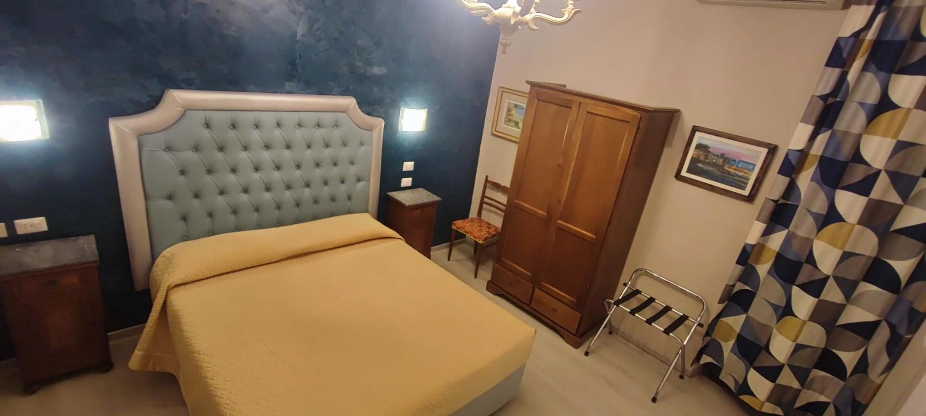 Bed in Hotel Merlini
