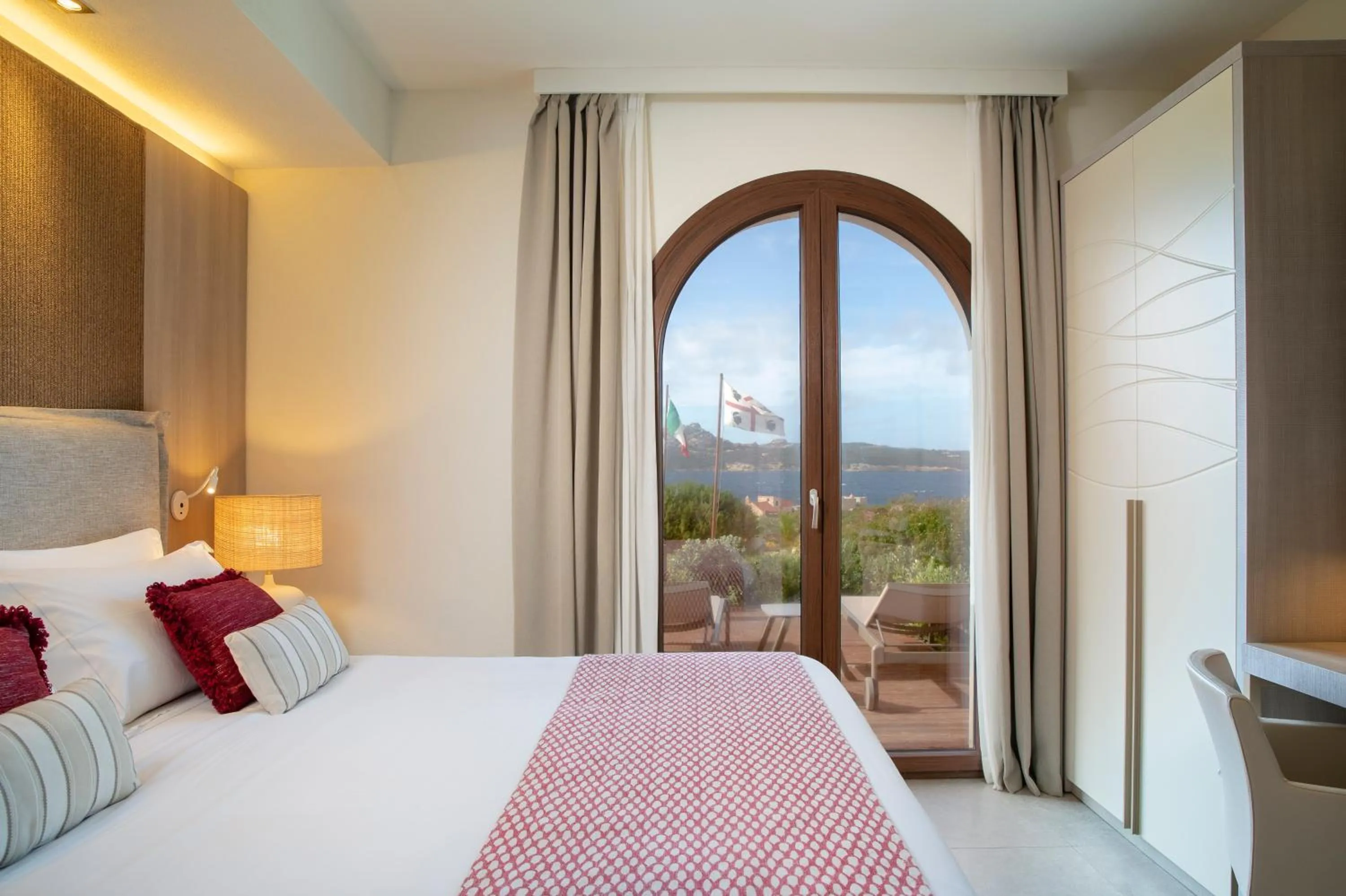 Photo of the whole room, Bed in Mangia's Santa Teresa Sardinia, Curio Collection by Hilton