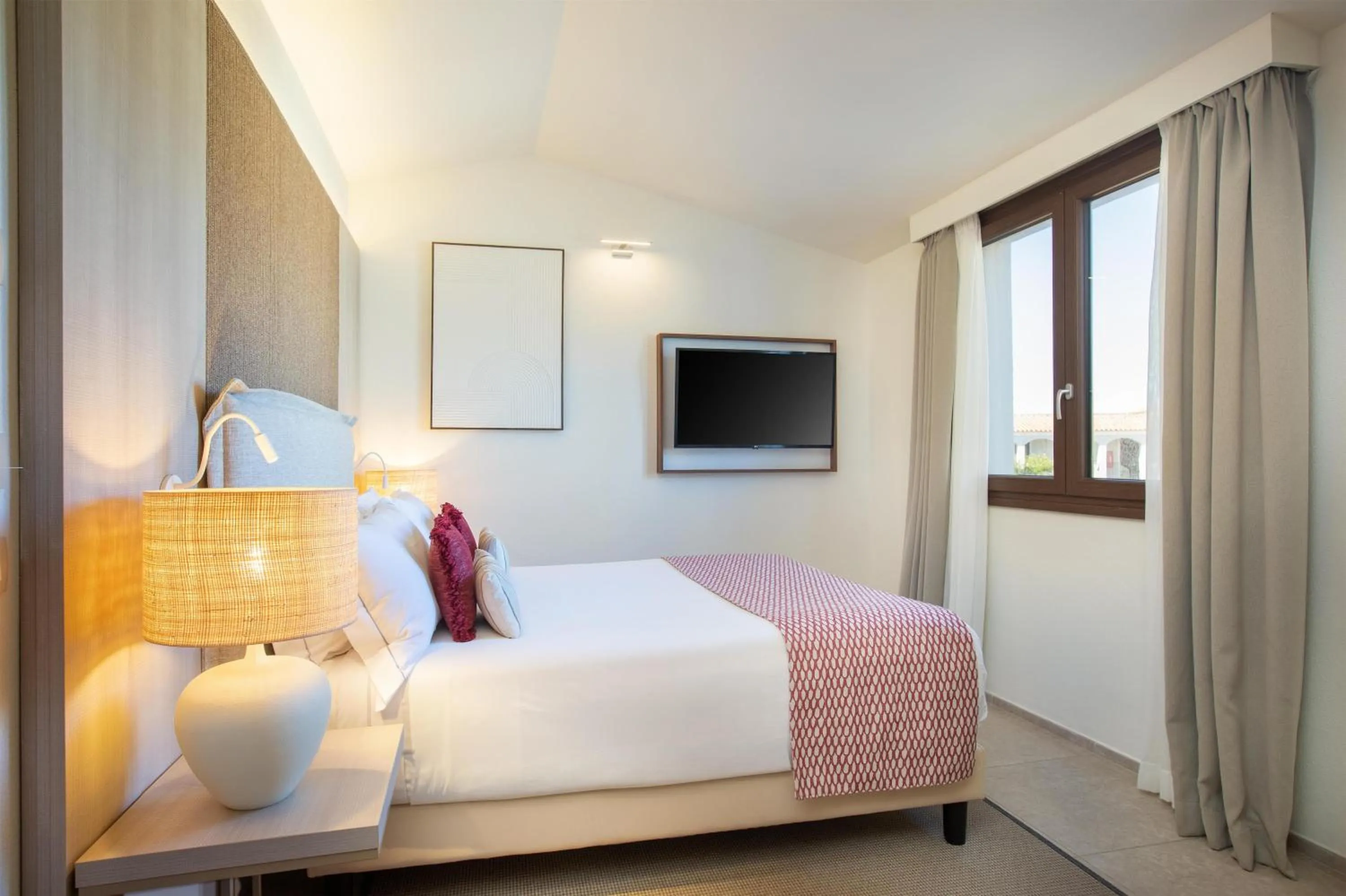 Bed in Mangia's Santa Teresa Sardinia, Curio Collection by Hilton