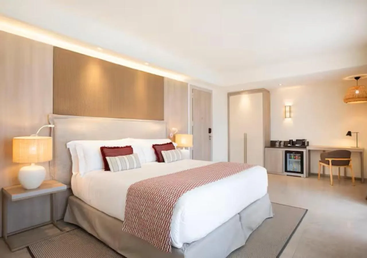 Bed in Mangia's Santa Teresa Sardinia, Curio Collection by Hilton