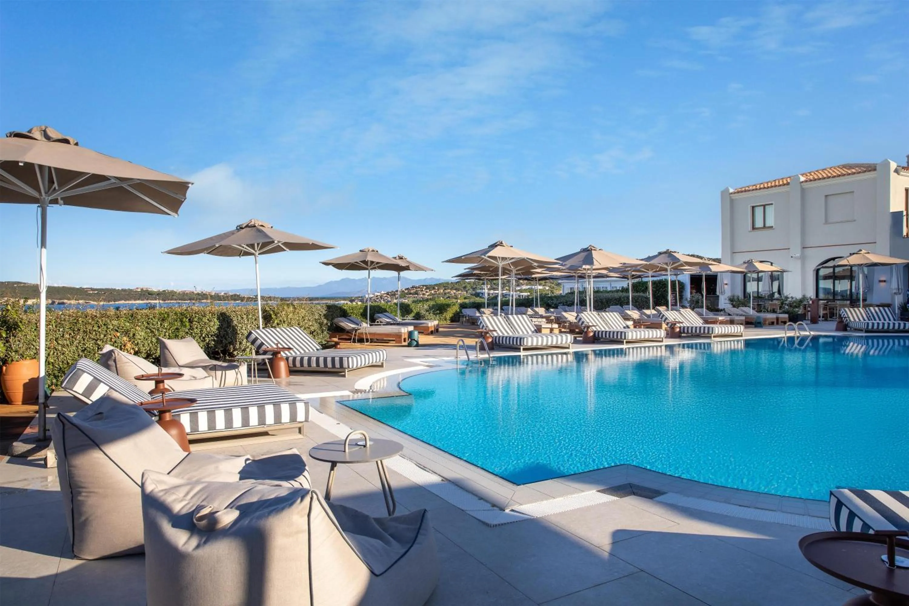 Pool view in Mangia's Santa Teresa Sardinia, Curio Collection by Hilton