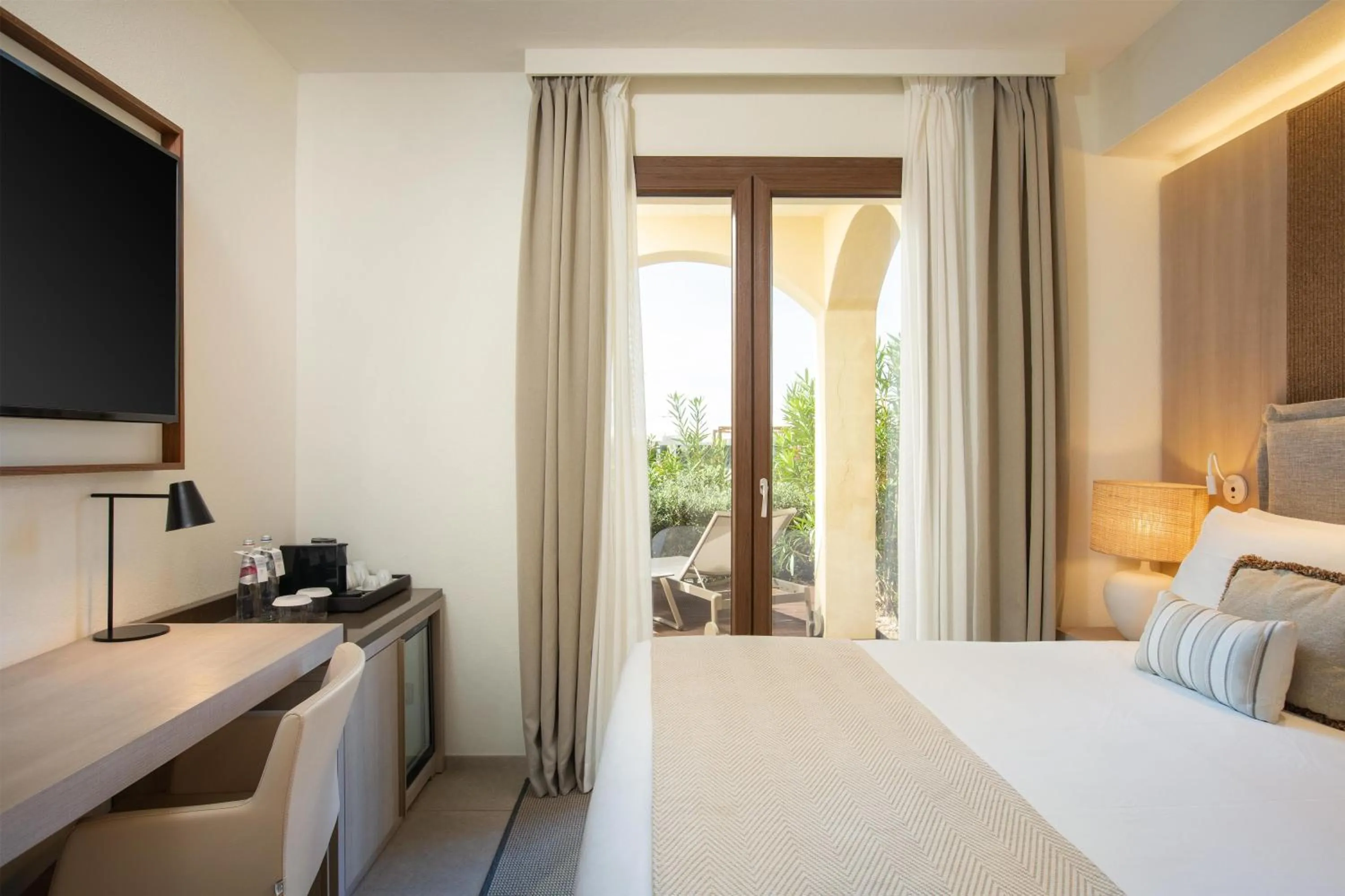 Bed in Mangia's Santa Teresa Sardinia, Curio Collection by Hilton