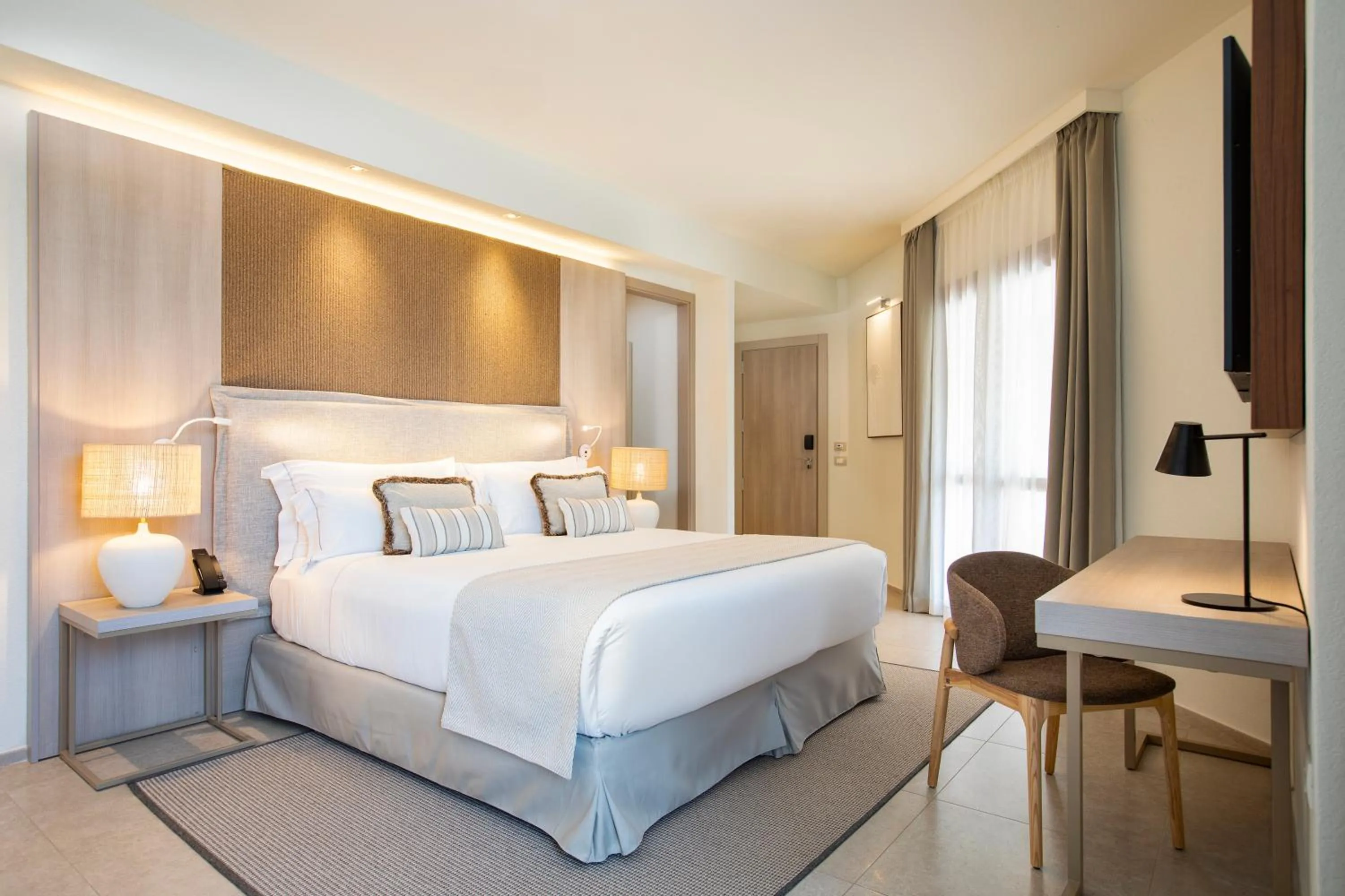 Bed in Mangia's Santa Teresa Sardinia, Curio Collection by Hilton