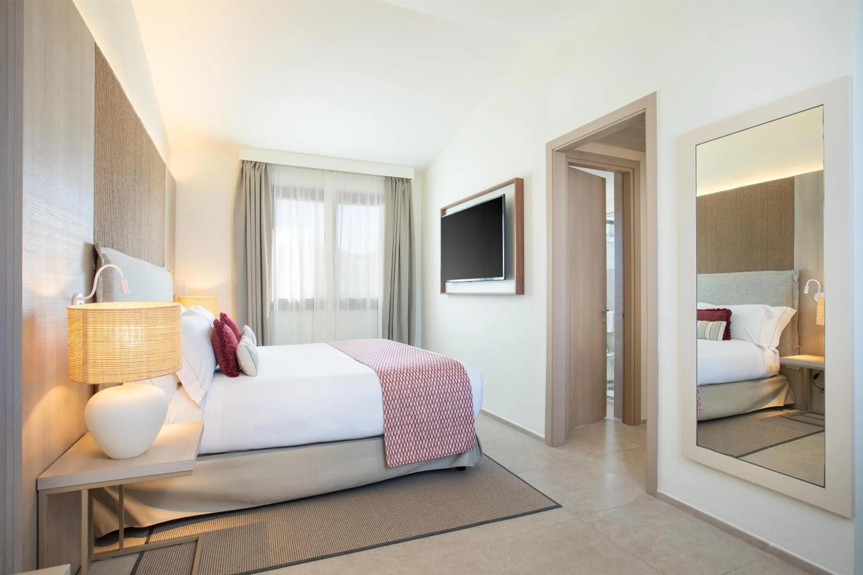 Bed in Mangia's Santa Teresa Sardinia, Curio Collection by Hilton