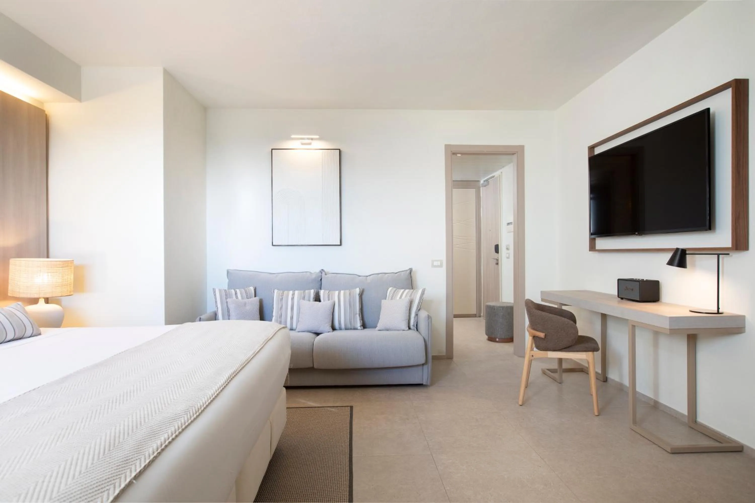 Photo of the whole room, Bed in Mangia's Santa Teresa Sardinia, Curio Collection by Hilton