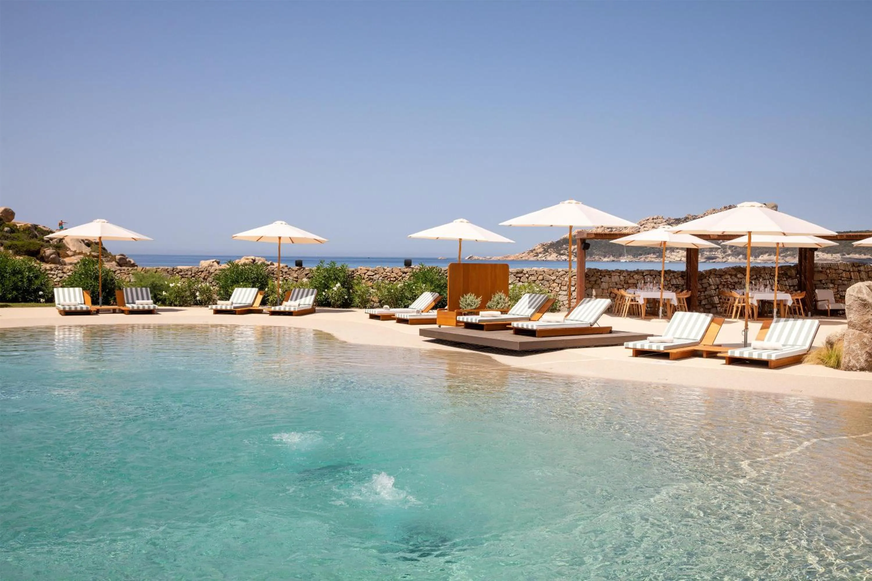 Pool view in Mangia's Santa Teresa Sardinia, Curio Collection by Hilton