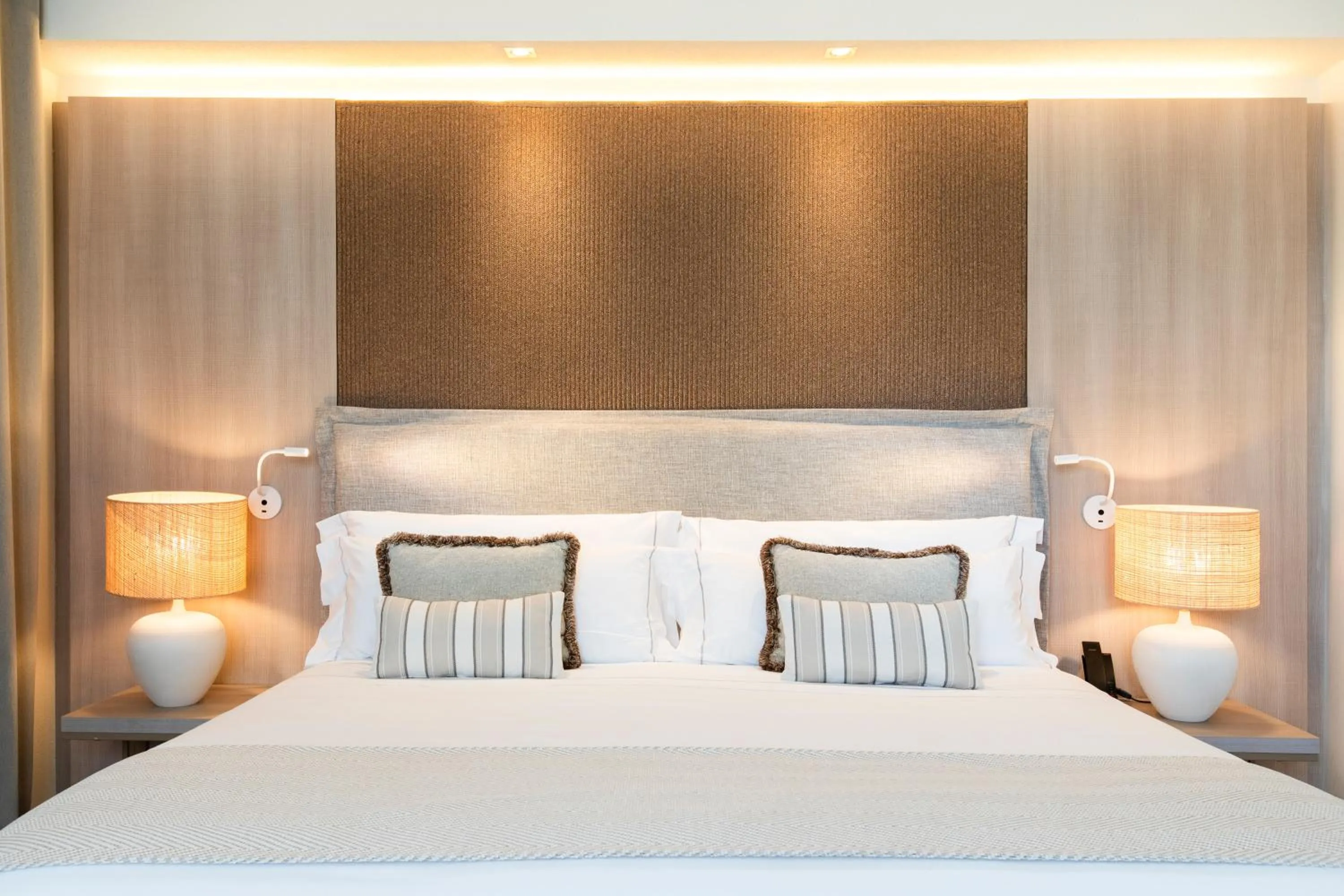 Bed in Mangia's Santa Teresa Sardinia, Curio Collection by Hilton