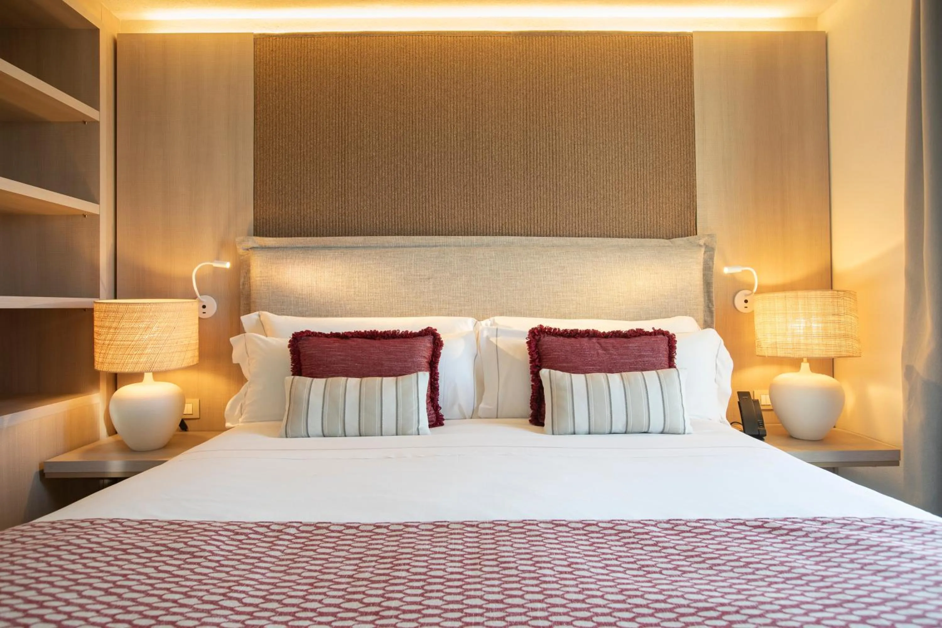 Bed in Mangia's Santa Teresa Sardinia, Curio Collection by Hilton