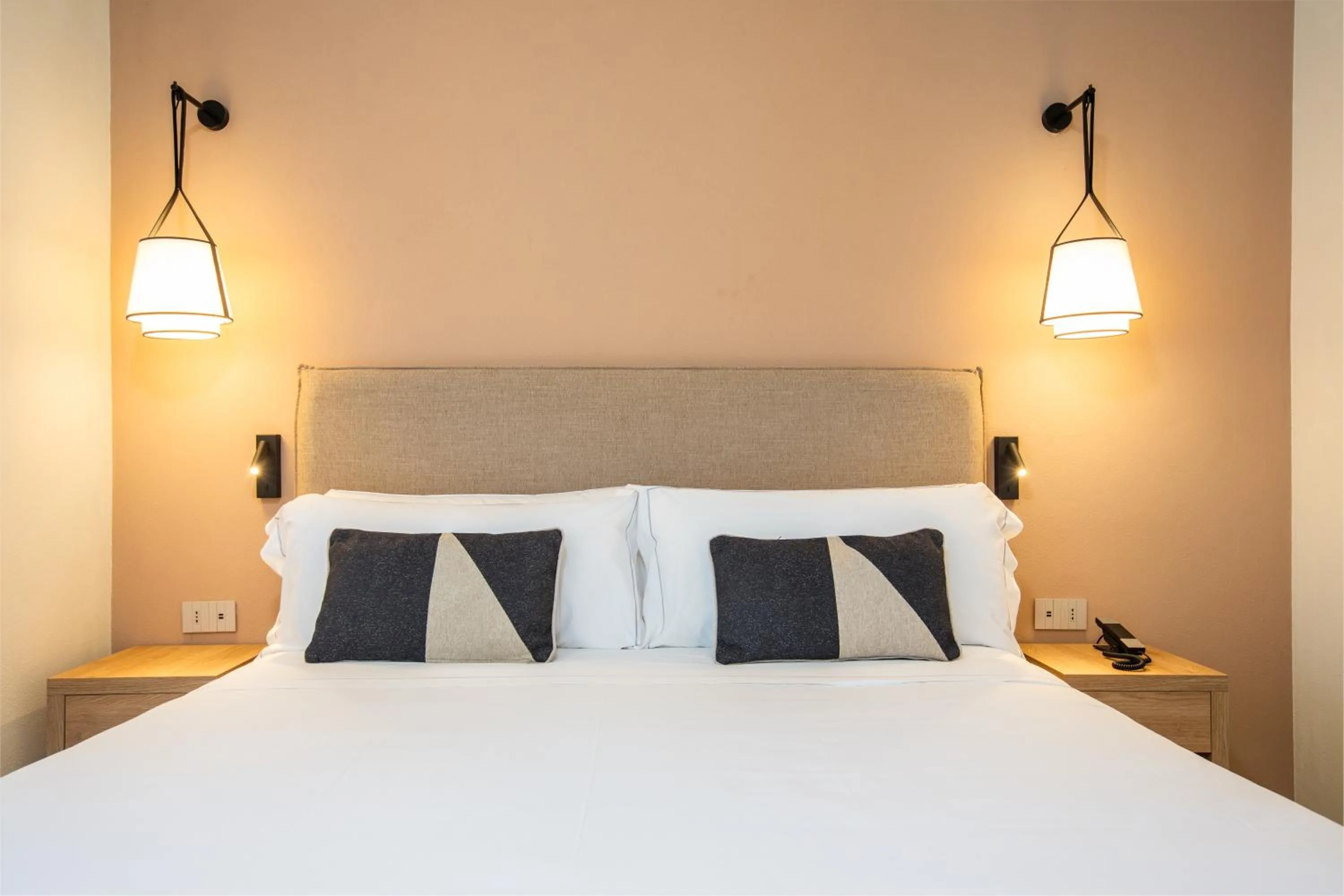 Bed in Mangia's Sardinia Resort