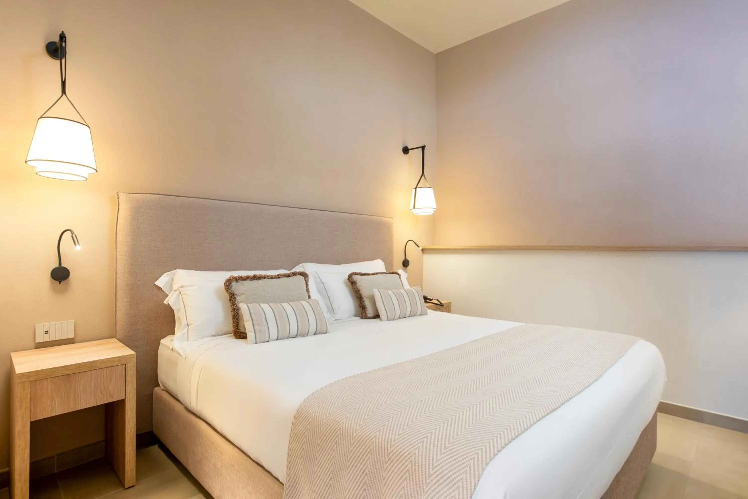 Bed in Mangia's Sardinia Resort