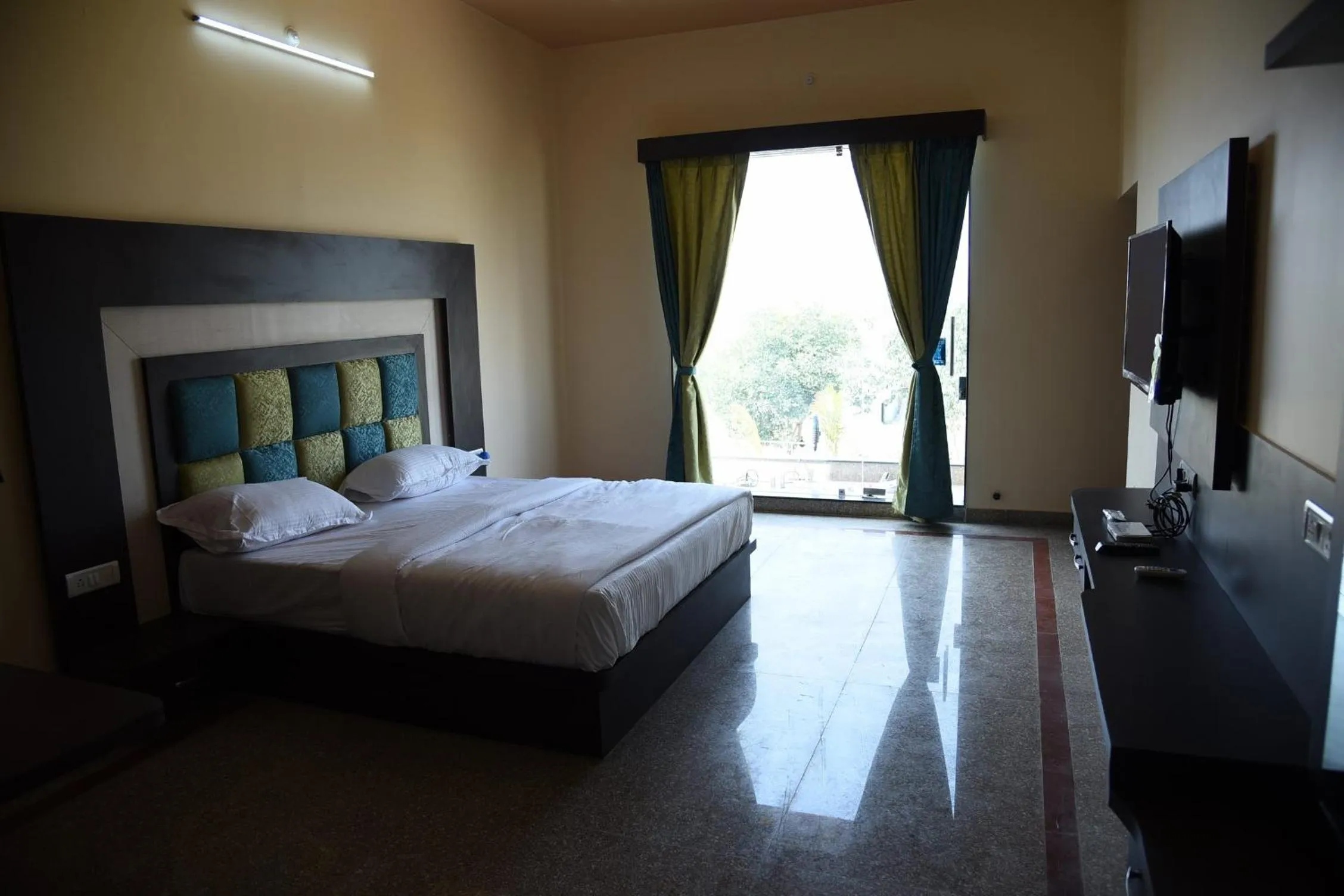 Bed in Chitrakoot Garden and Resorts