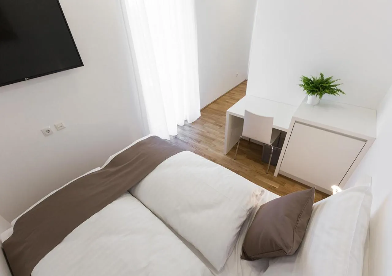 Bed in SHOME Hotel Graz I Self-Check-In I Free Parking