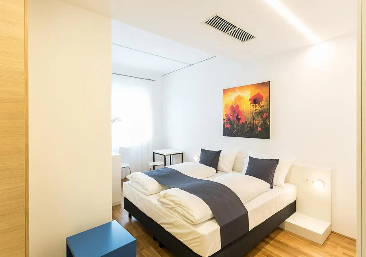 Bed in SHOME Hotel Graz I Self-Check-In I Free Parking