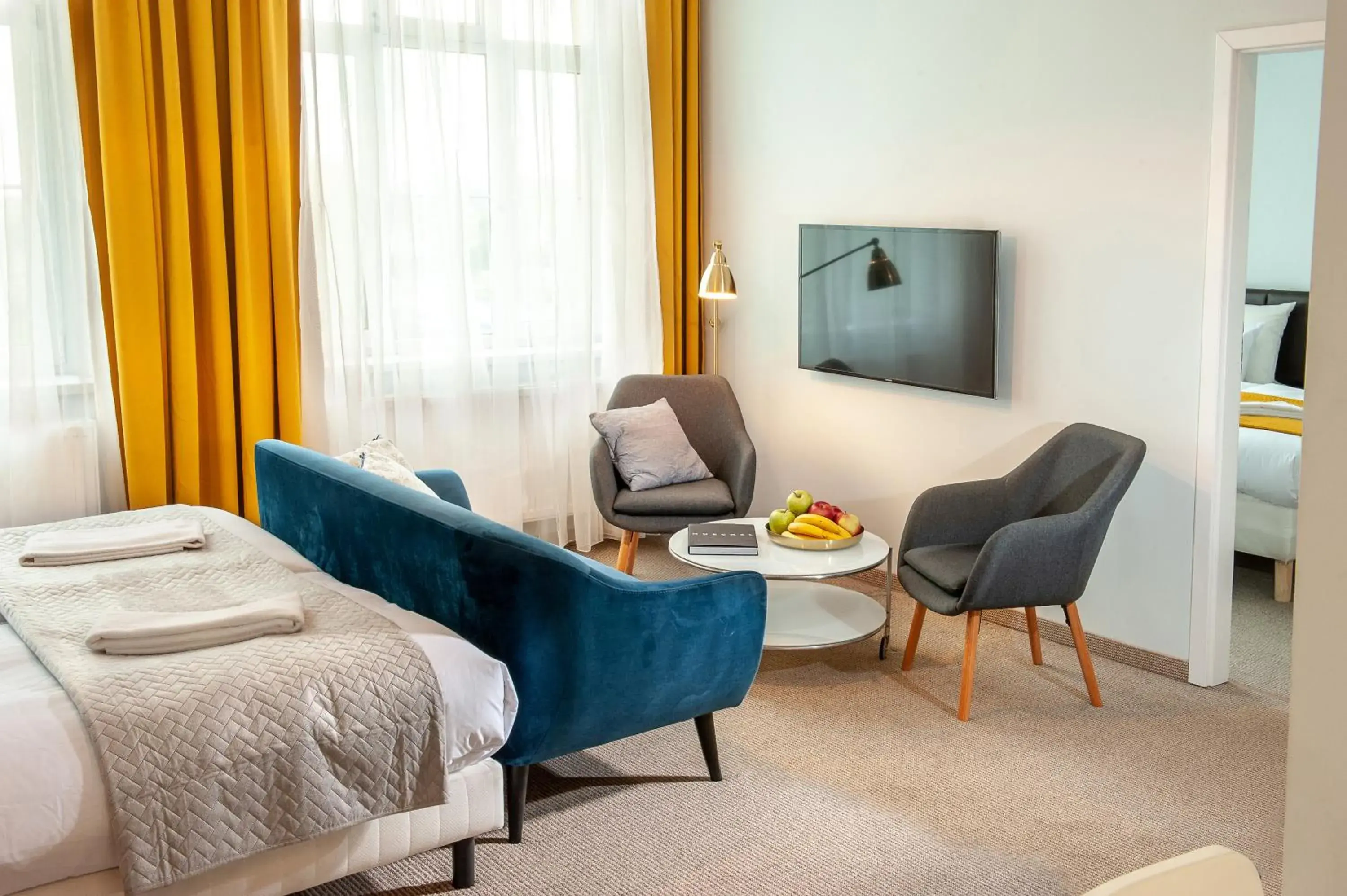 TV and multimedia, Seating Area in Holiday Suites Cracow
