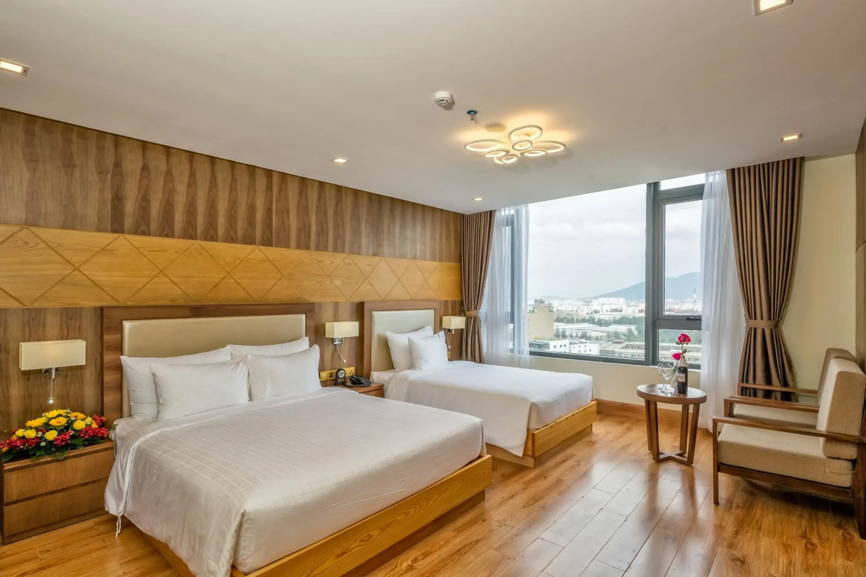 Deluxe Partial Sea View Triple Room with Bathtub - Complimentary Welcome Fruit in Nhu Minh Plaza Danang Hotel Deluxe Partial Sea View Triple Room with Bathtub - Complimentary Welcome Fruit in Nhu Minh Plaza Danang Hotel