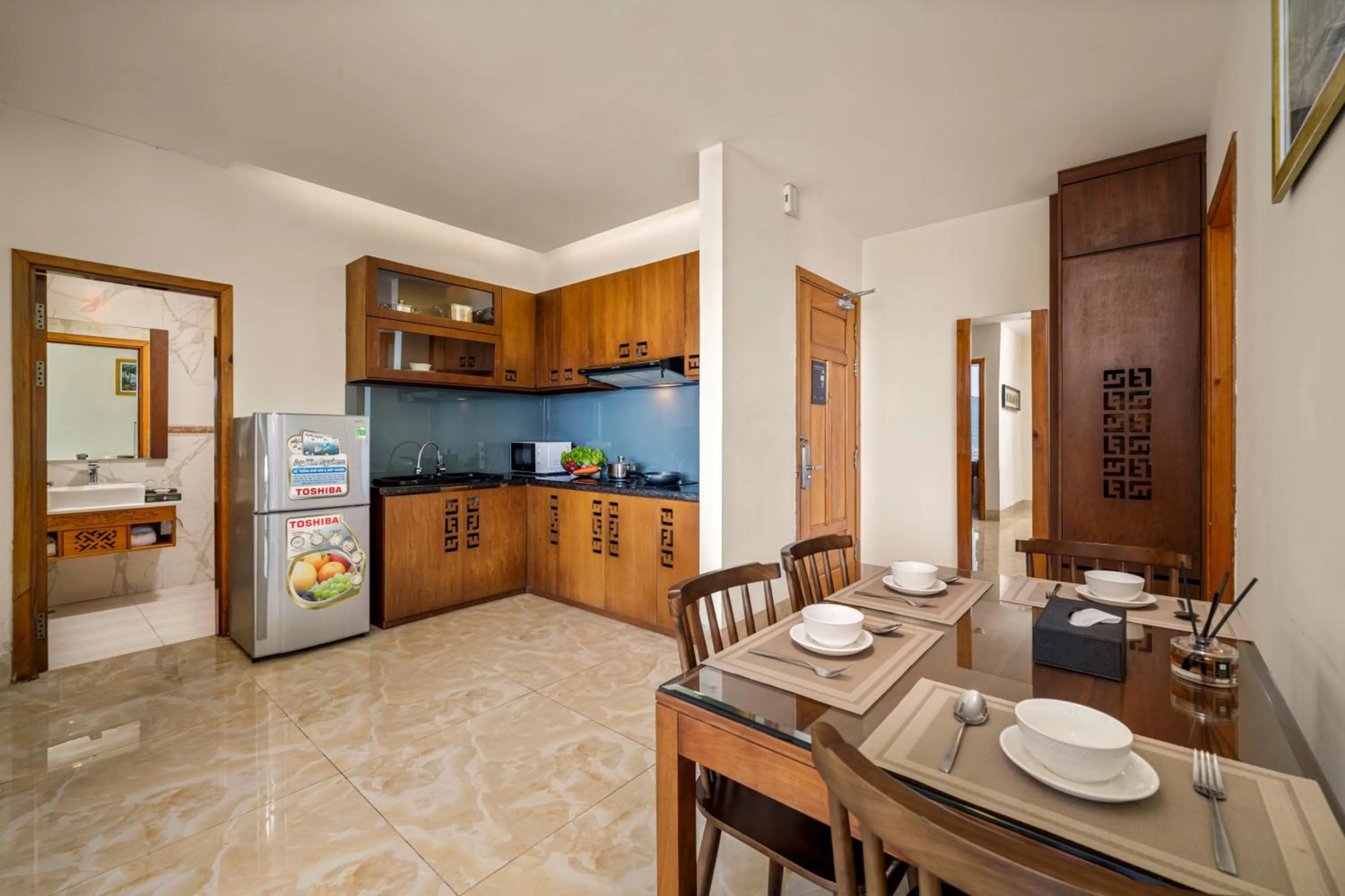 Kitchen or kitchenette in Nhu Minh Plaza Danang Hotel