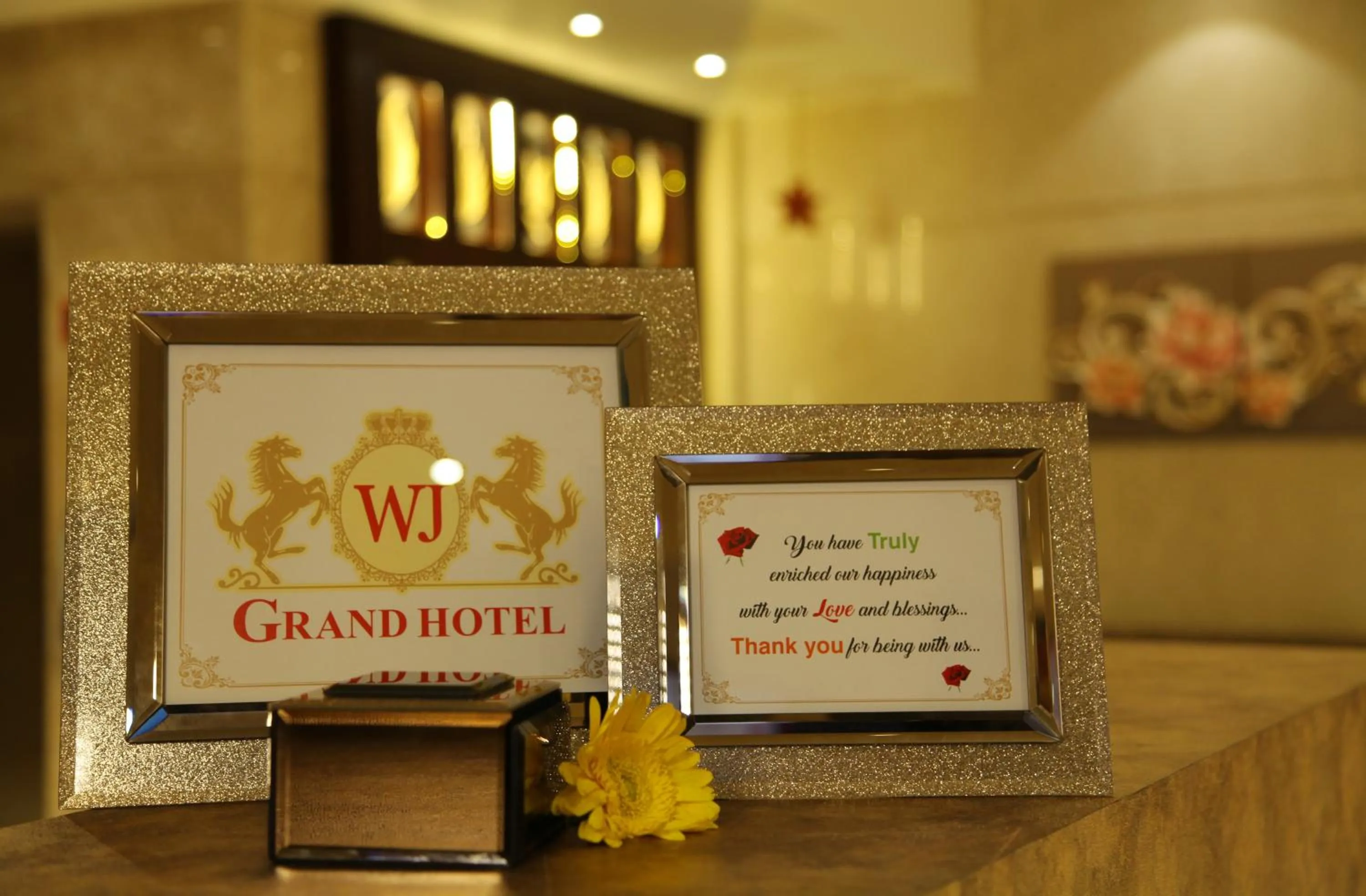Property logo or sign in Hotel WJ Grand