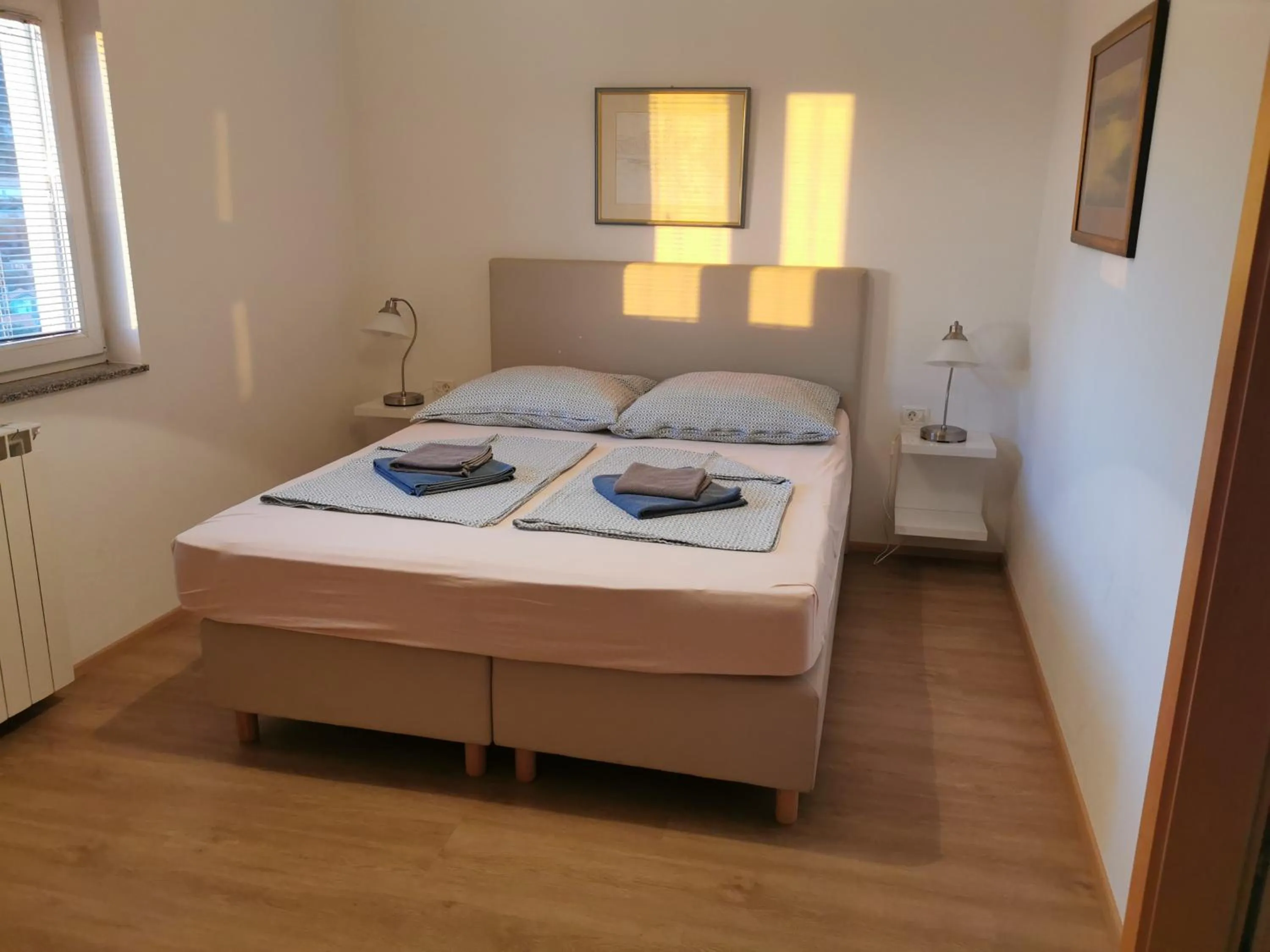 Bed in BC Better Choice Apartments with Central Heating