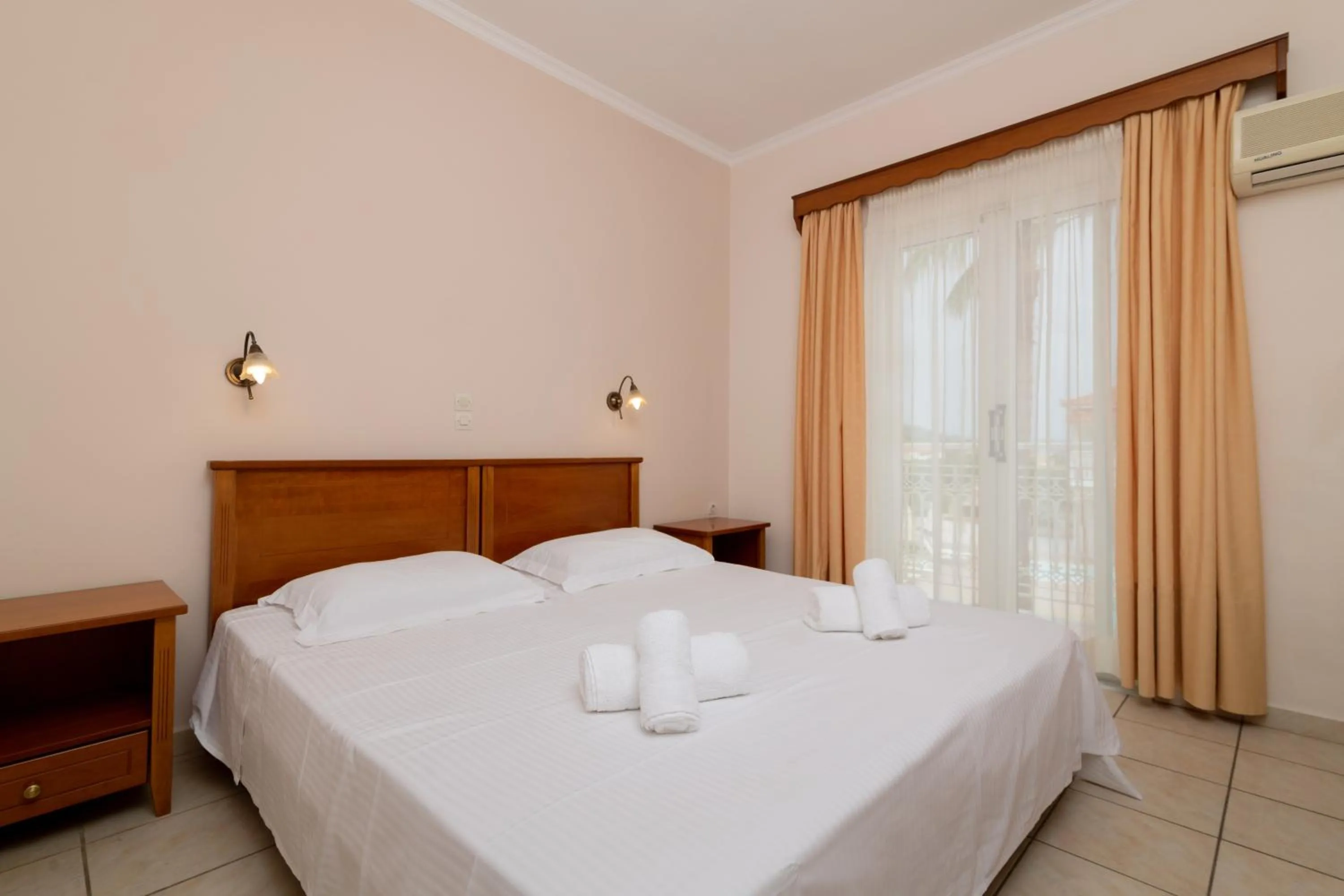 Bed in Edelweiss Hotel