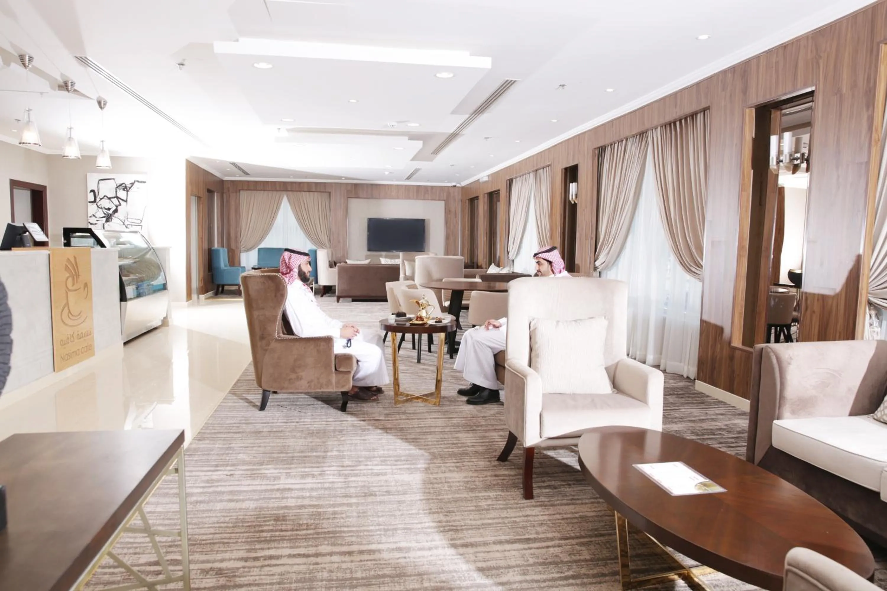 Communal lounge/ TV room in Nasima Serviced Apartments - Economy