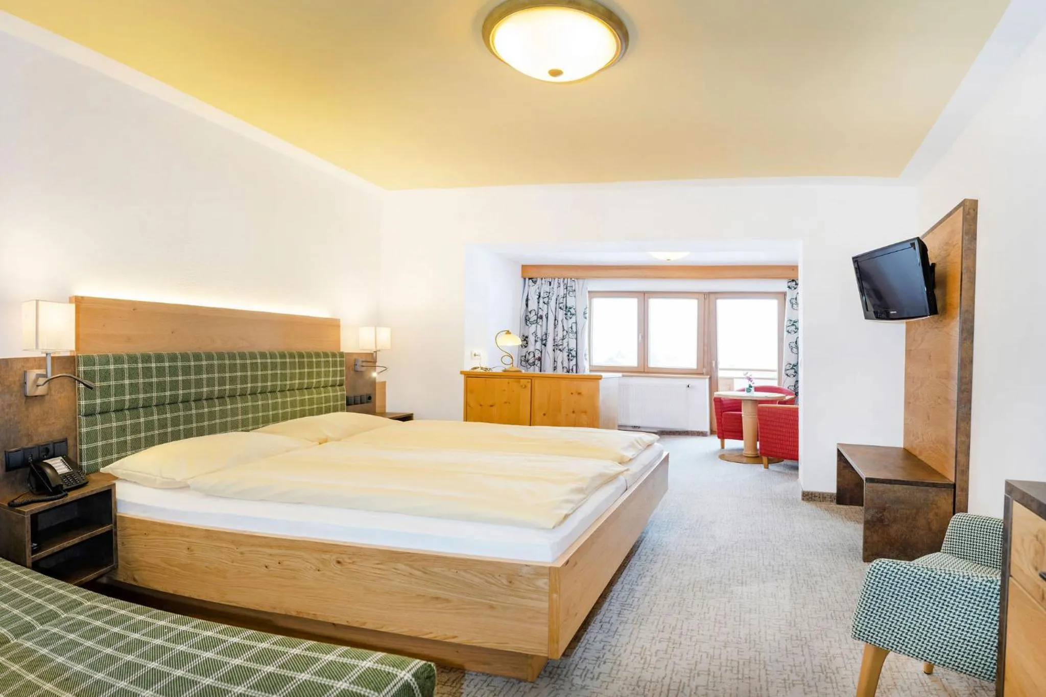 Photo of the whole room, Bed in Landhotel Tirolerhof - Wildschönau - PREMIUM Card im Sommer