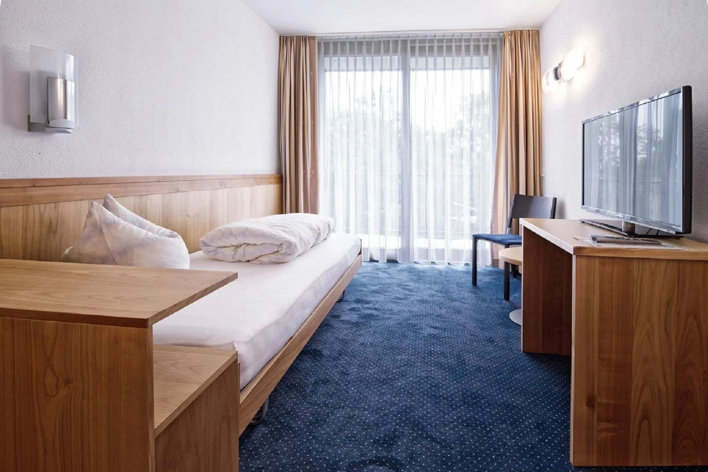 Photo of the whole room, Bed in Hotel Rössli Tufertschwil