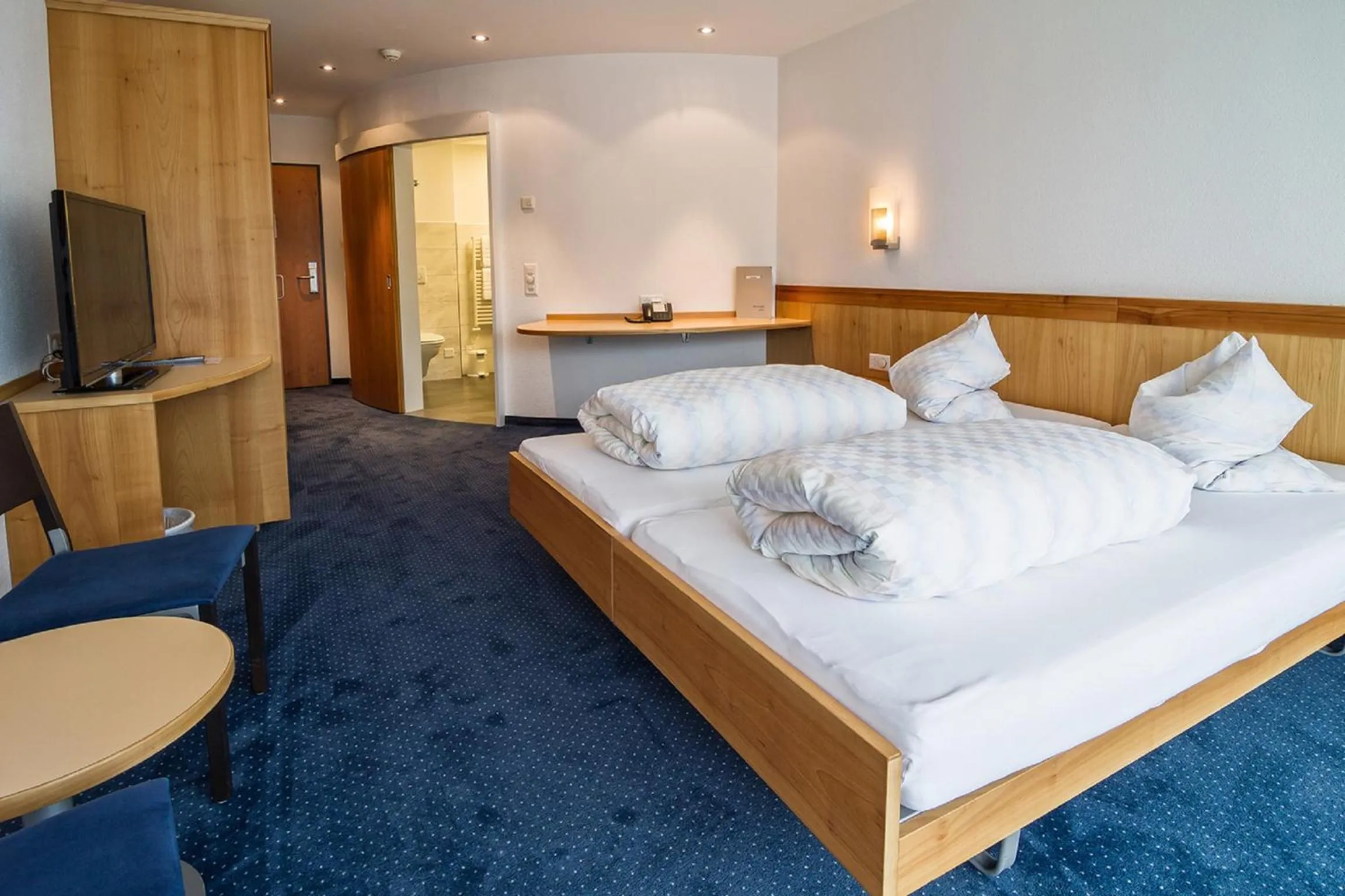 Photo of the whole room, Bed in Hotel Rössli Tufertschwil