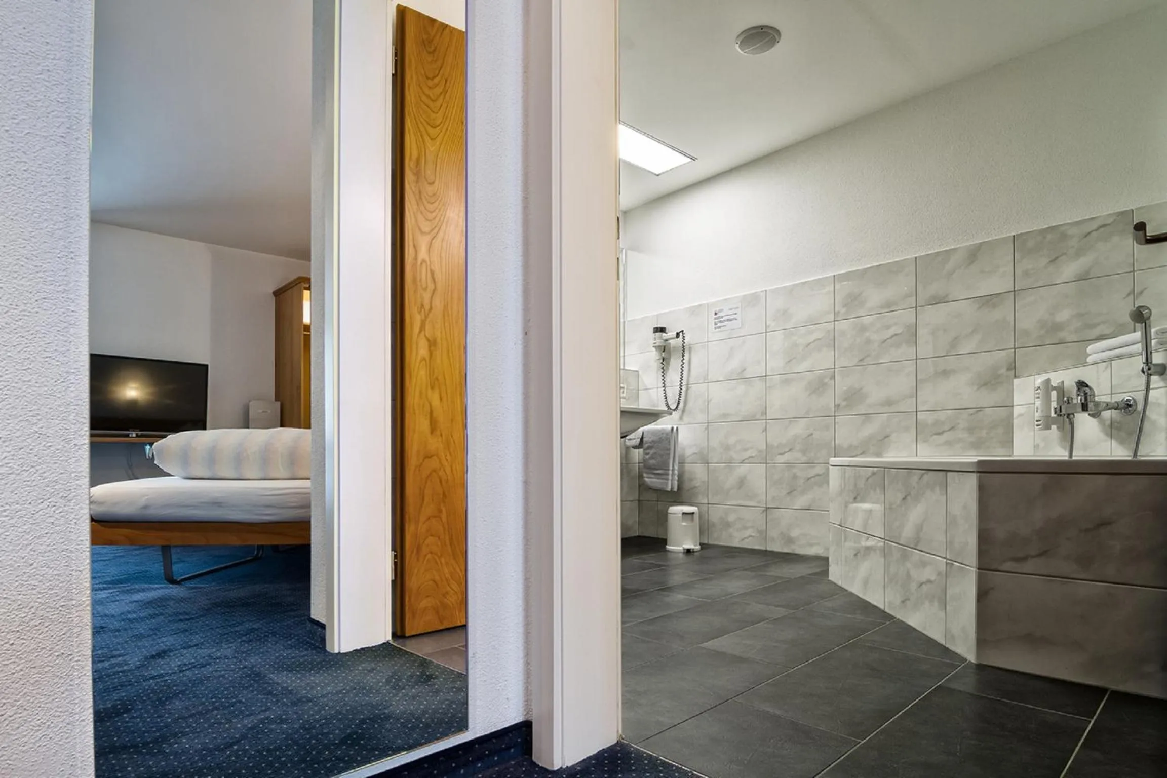 Decorative detail, Bed in Hotel Rössli Tufertschwil