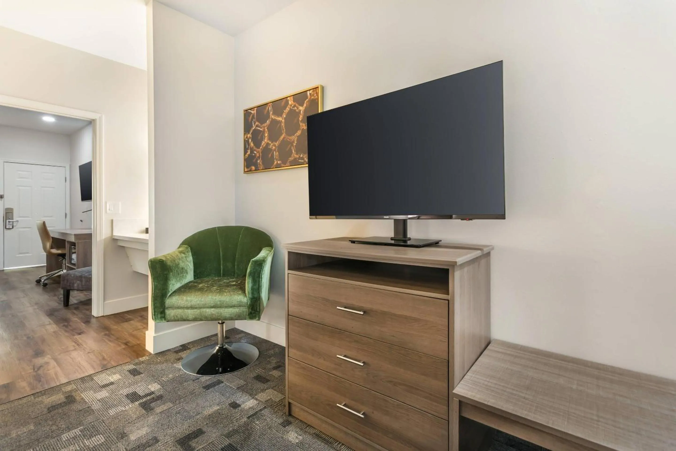 Bedroom in University Park Inn & Suites, an Ascend Collection Hotel