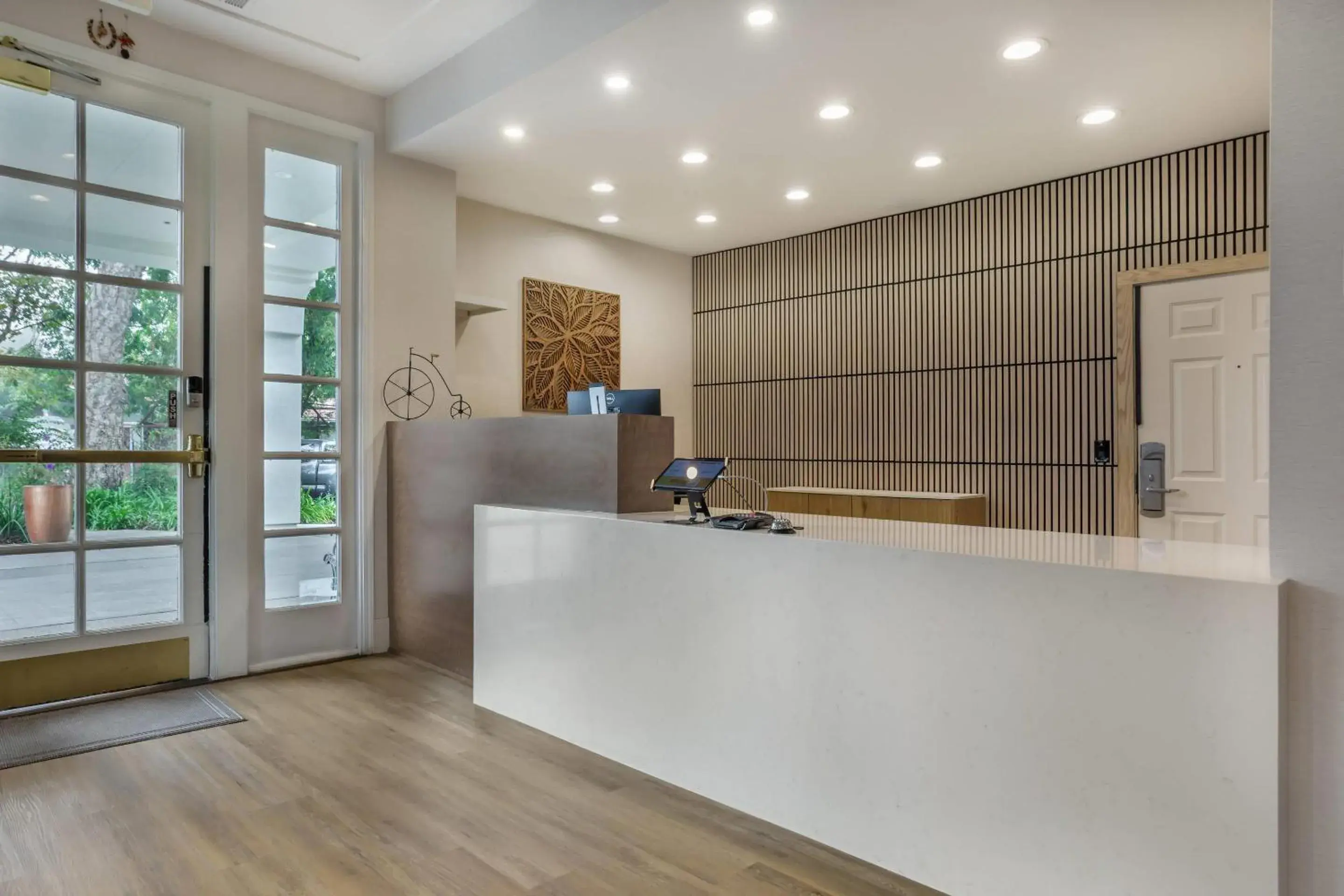 Lobby or reception in University Park Inn & Suites, an Ascend Collection Hotel Lobby or reception in University Park Inn & Suites, an Ascend Collection Hotel